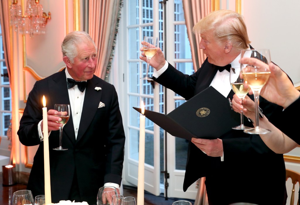 Donald Trump and King Charles in black tuxedos.