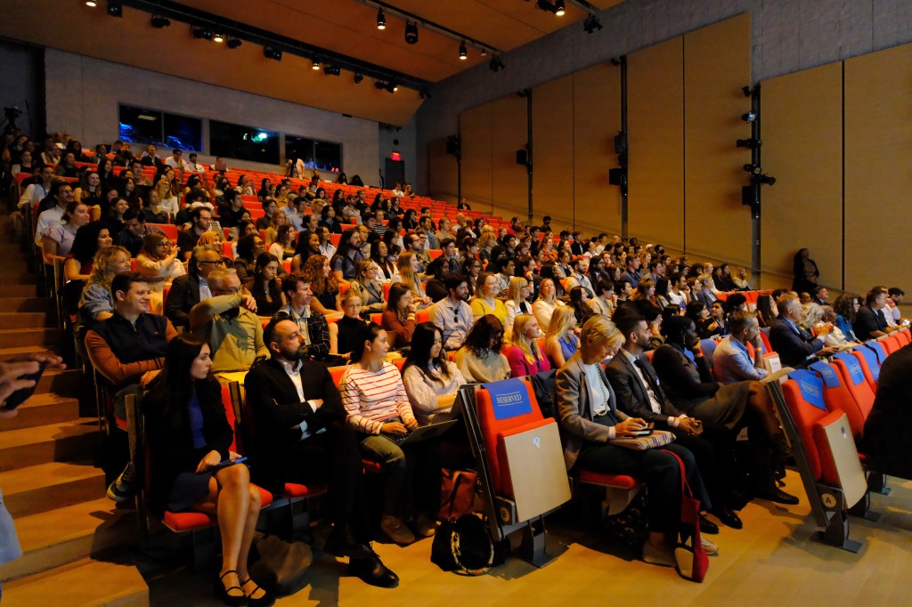 A large audience at a lecture.