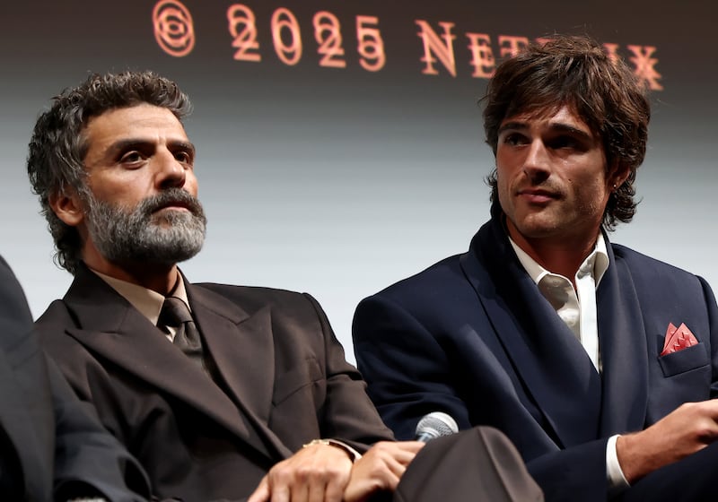 Oscar Isaac and Jacob Elordi speak onstage during Netflix's 