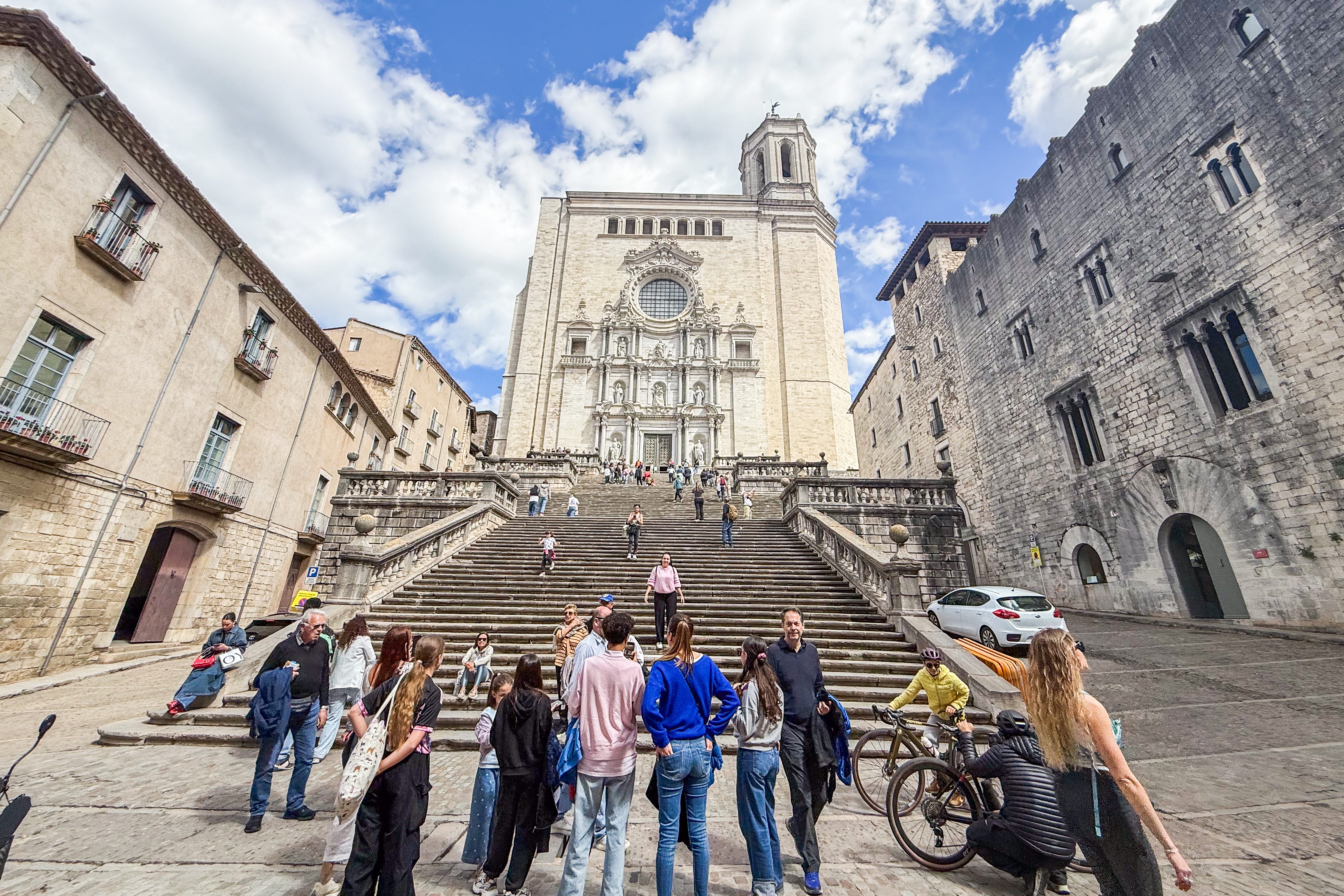 People walking in front of cathedral in Girona