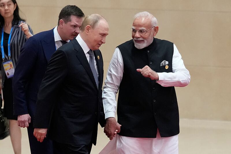 Indian Prime Minister Narendra Modi (R) walks next to Russian President Vladimir Putin during the Shanghai Cooperation Organization (SCO) Summit 2025 at the Meijiang Convention and Exhibition Centre on September 1, 2025 in Tianjin, China. (Photo by Suo Takekuma - Pool/Getty Images)