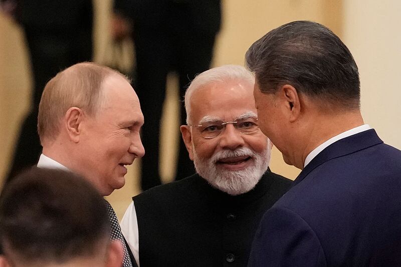 Indian Prime Minister Narendra Modi talks with Russian President Vladimir Putin(L) and Chinese President Xi jinping ahead of the Shanghai Cooperation Organization (SCO) Summit 2025 at the Meijiang Convention and Exhibition Centre on September 1, 2025 in Tianjin, China. (Photo by Suo Takekuma - Pool/Getty Images)