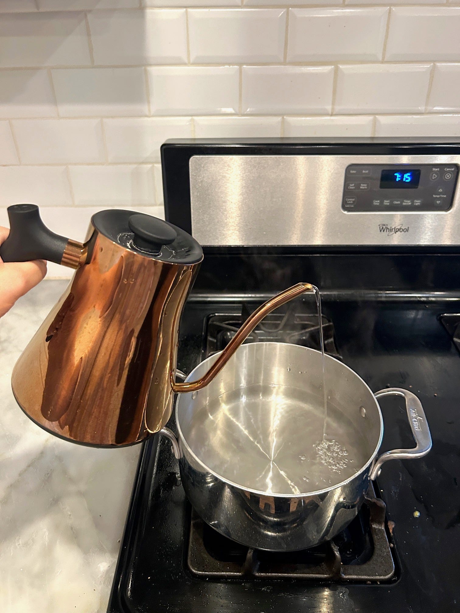 Adding hot water from kettle to pot for Gordon Ramsay's cacio e pepe