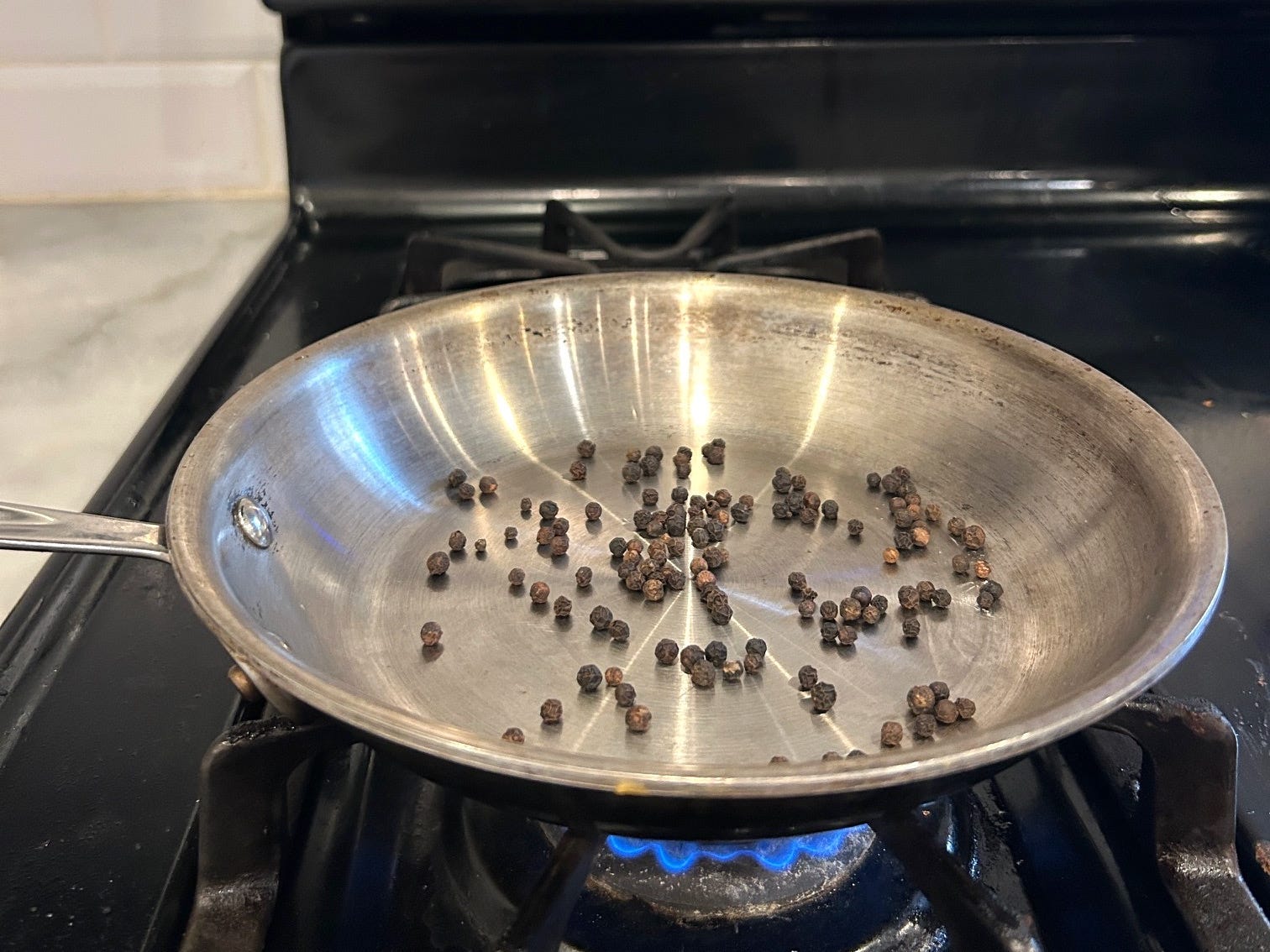 Toasting peppercorn for Gordon Ramsay's cacio e pepe