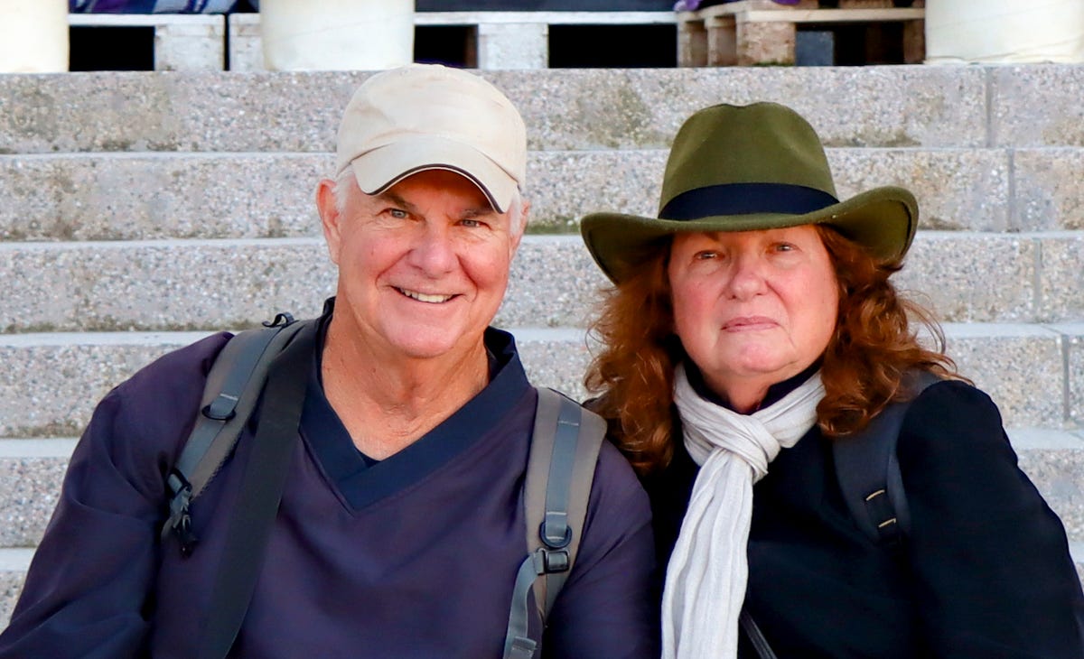 Mary Charlebois and Kevin Scanlon wearing hats, smiling