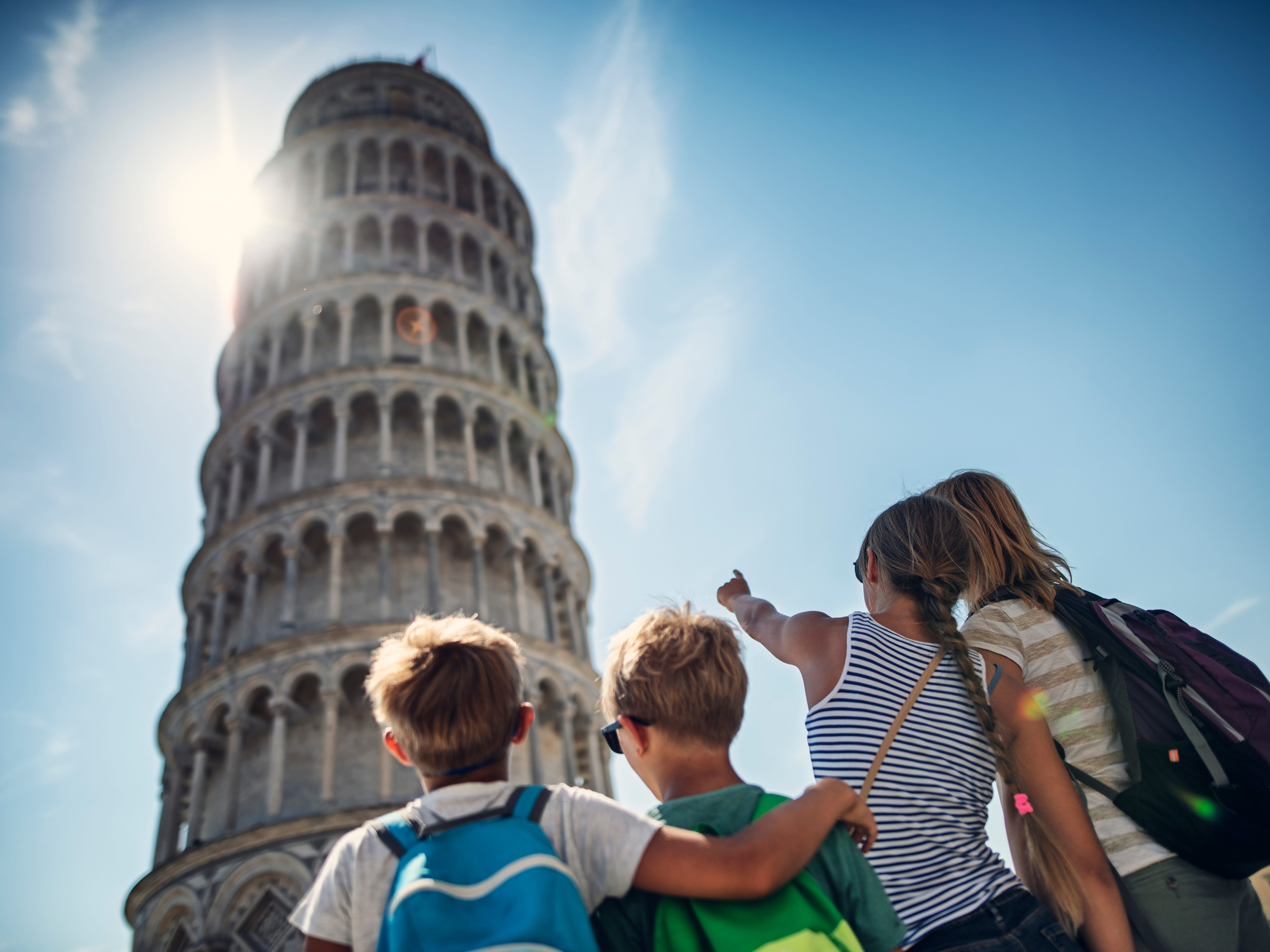 Family looking at the famous Leaning Tower of Pisa