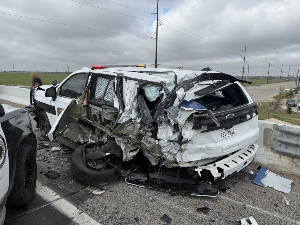 The distracted truck driver crashed into the rear of the police cruiser.