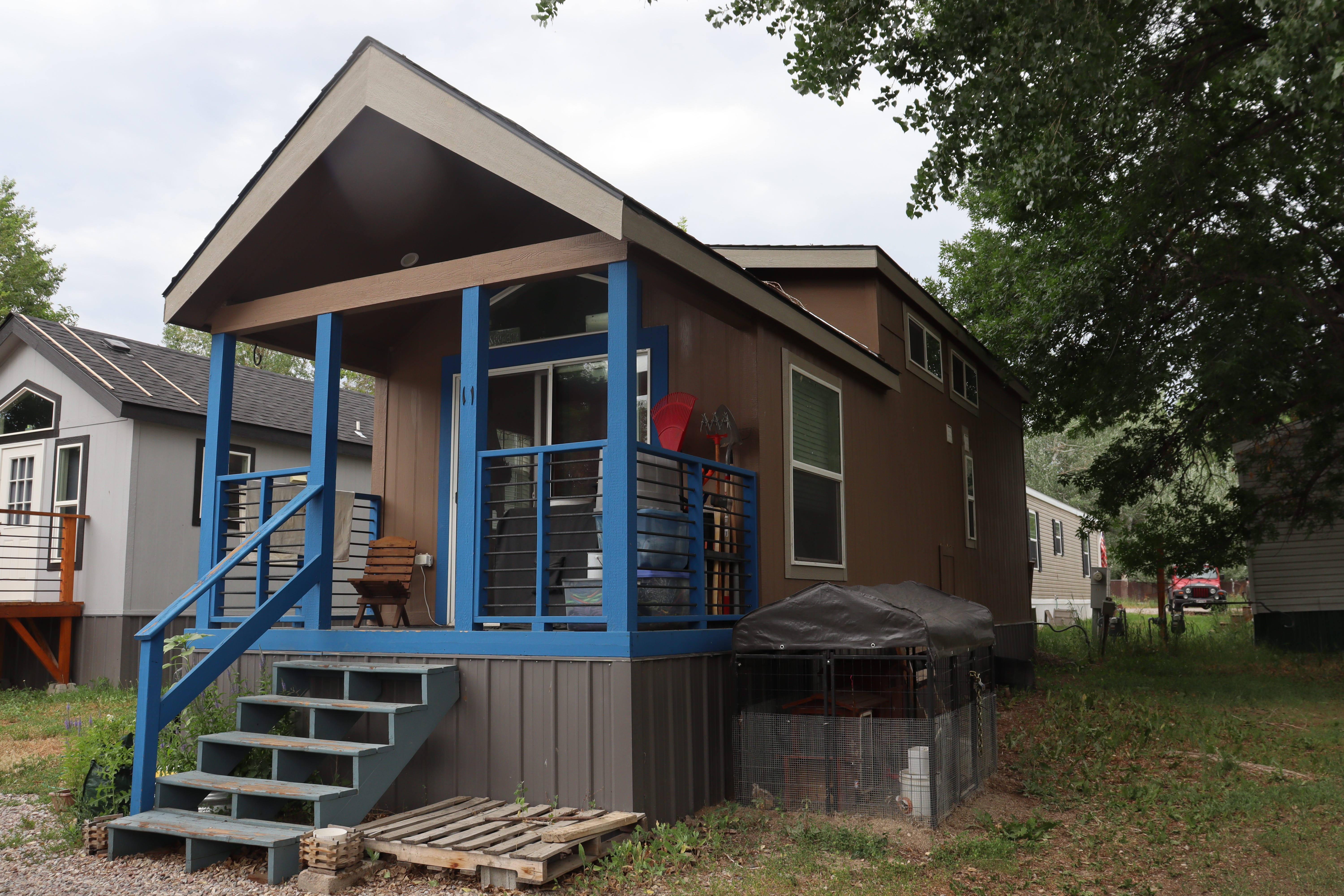 Tiny home with blue railings