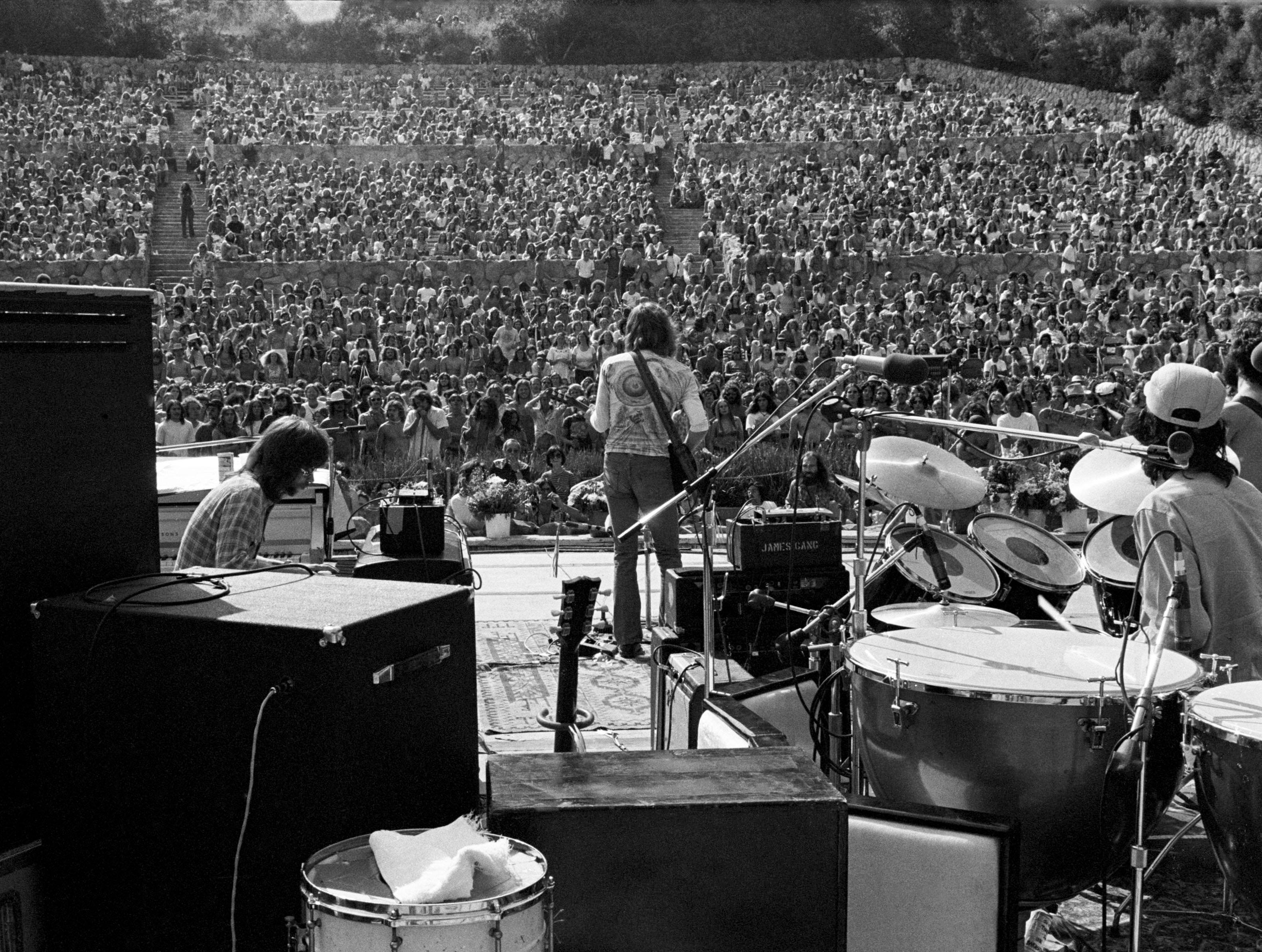 The Eagles perform for a large crowd in 1975.