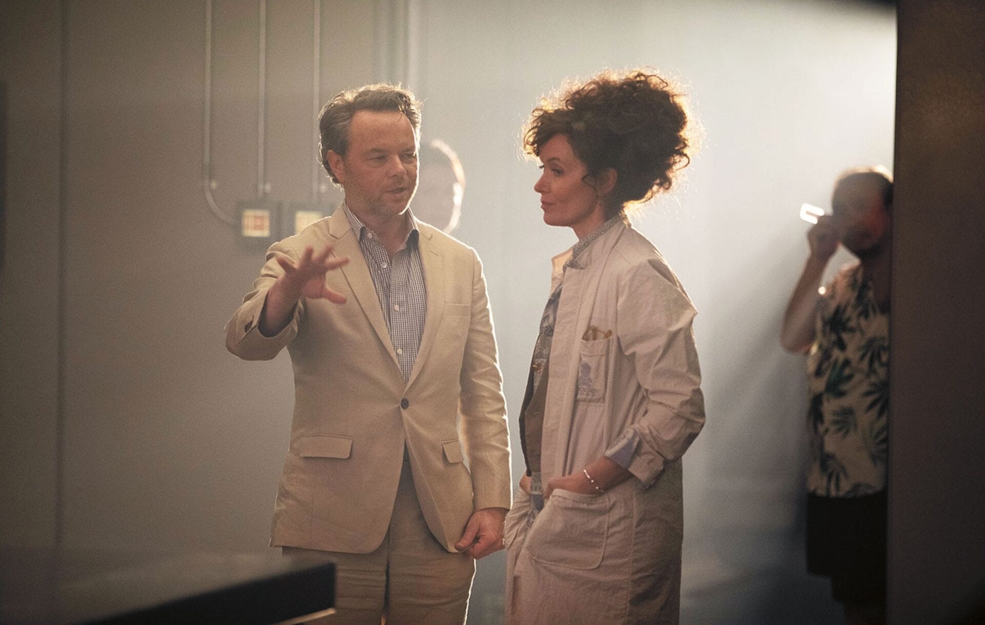 Noah Hawley with an actor in costume on the set of Alien: Earth.