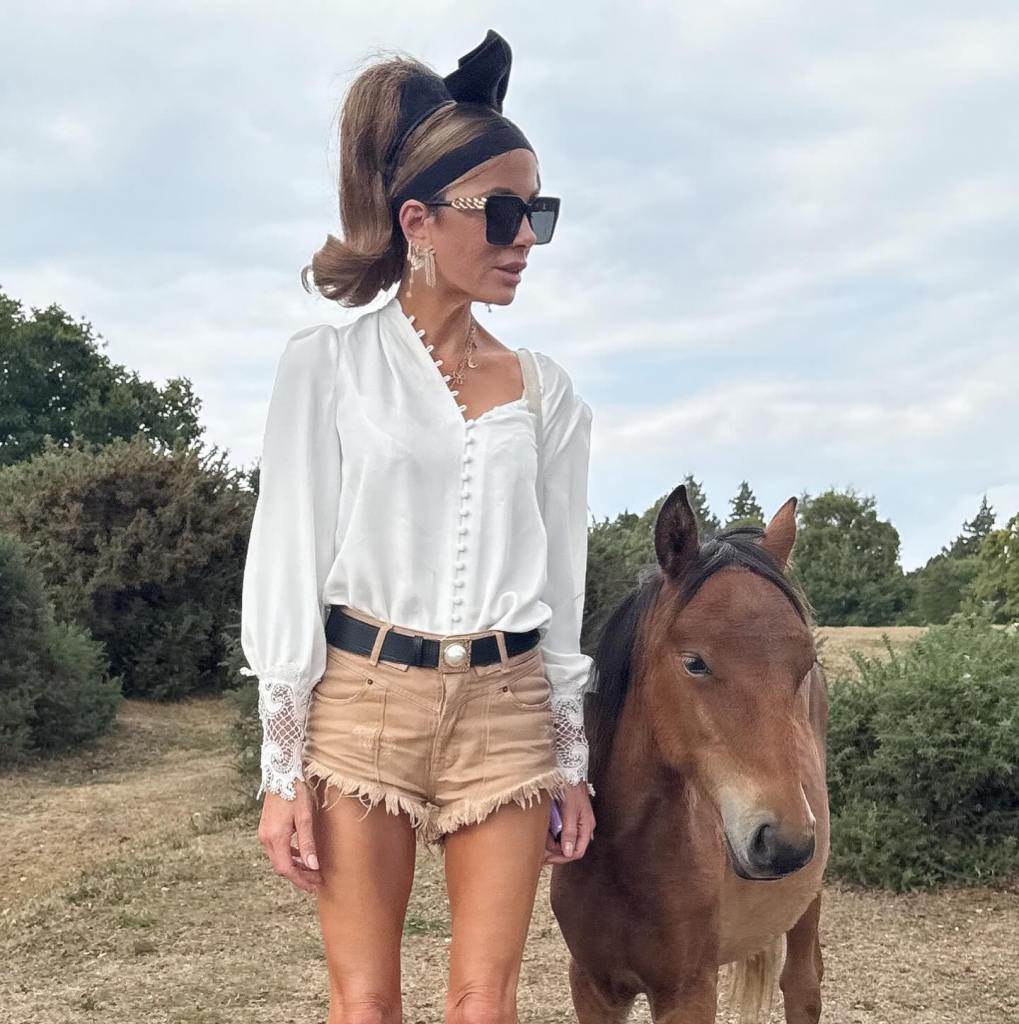 Kate Beckinsale poses with a mini horse.
