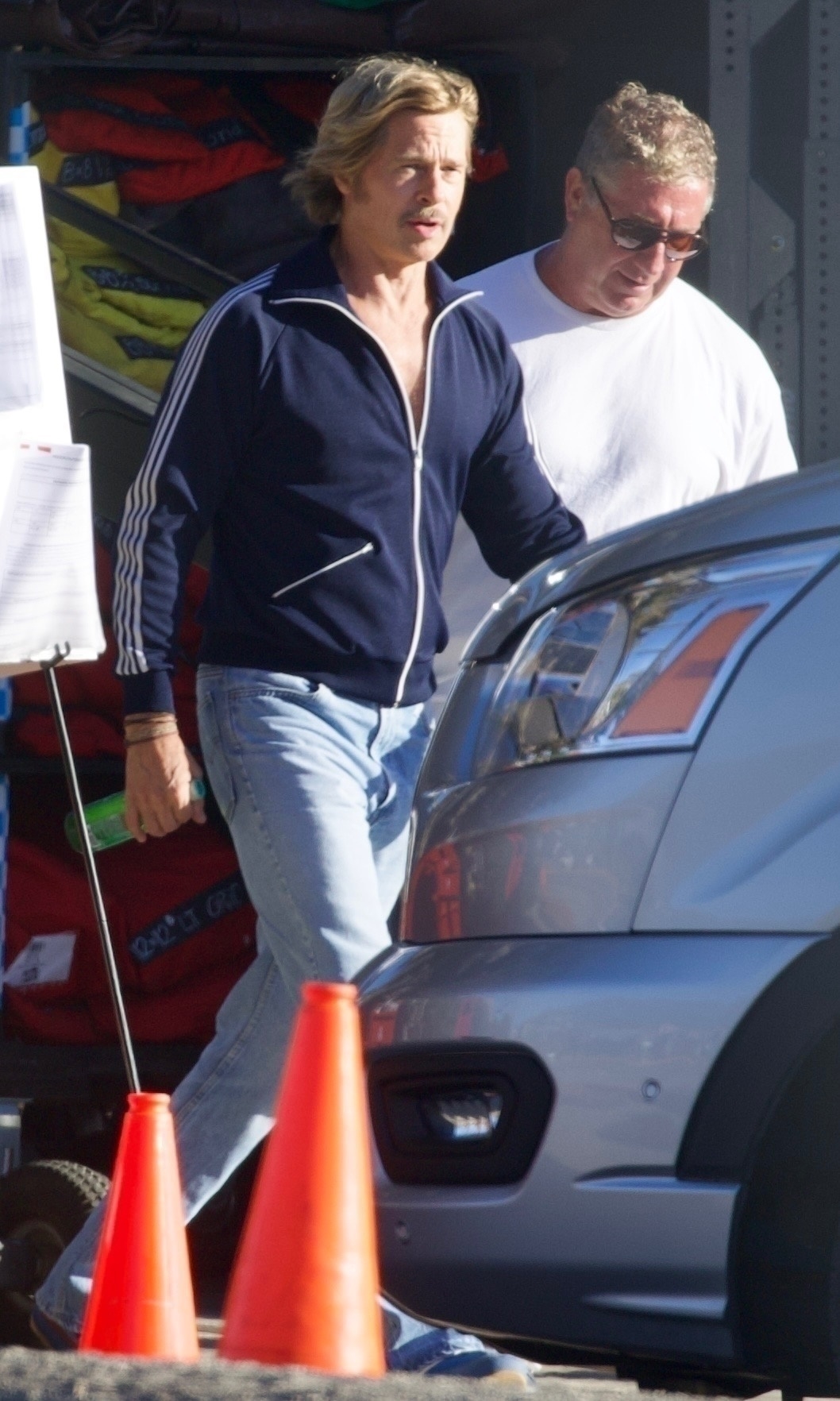Brad Pitt sports a mullet and a mustache while on set in Malibu, California.