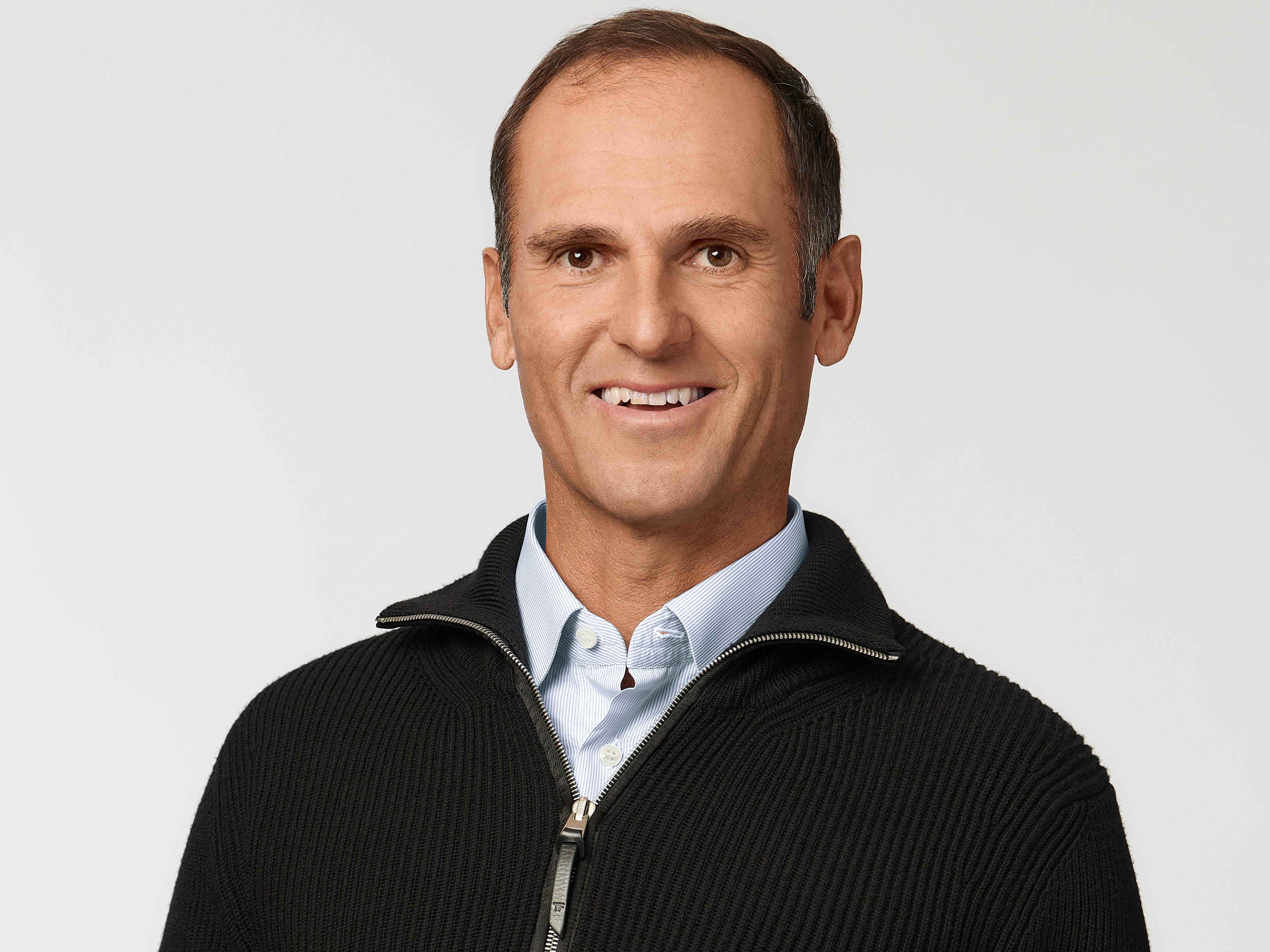 Egon Durban in a black zip up sweater