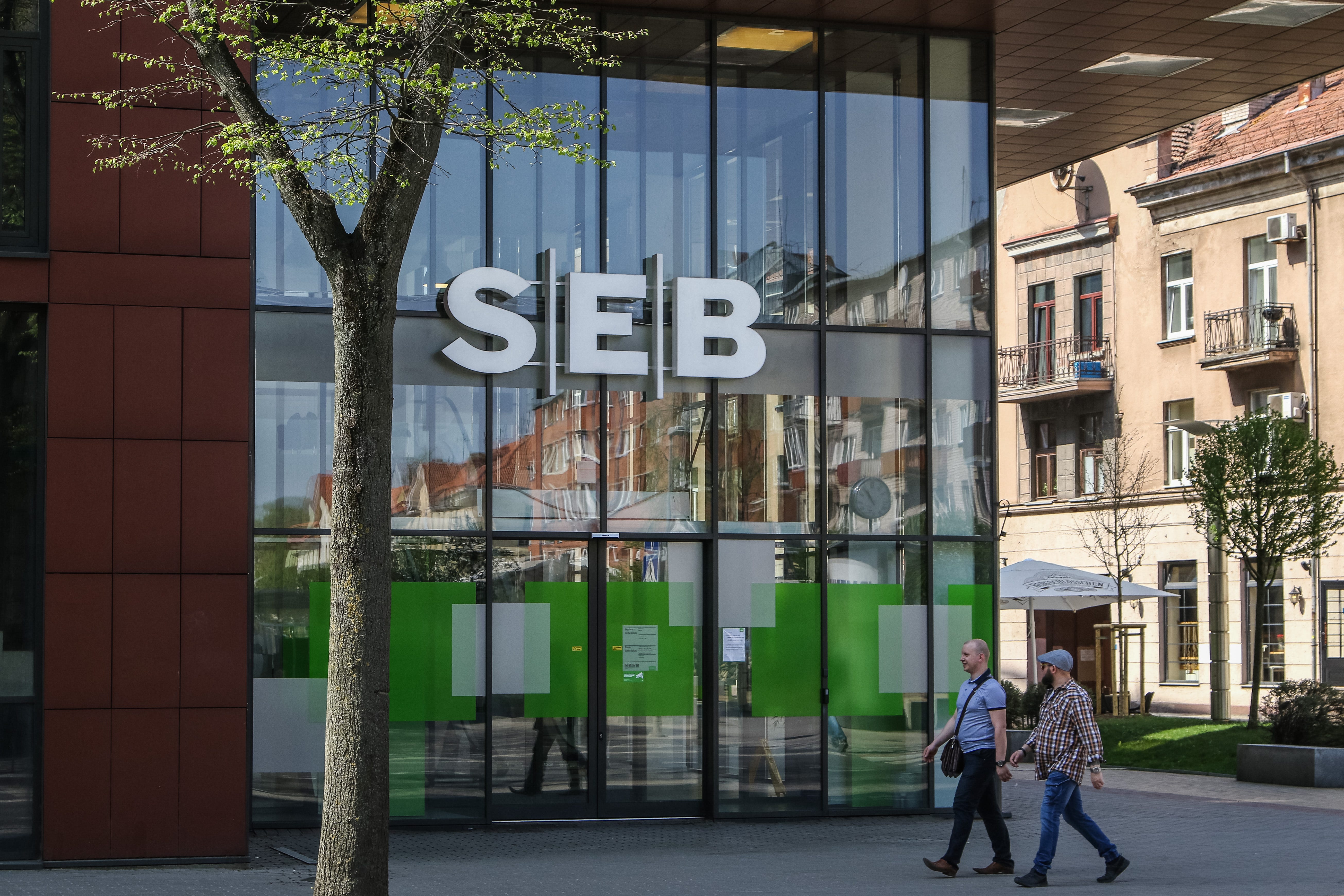 People walking in front of SEB bank (Skandinaviska Enskilda Banken AB) are seen in a port city of Klaipeda, Lithuania on 27 April 2019
