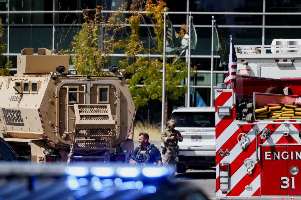 A SWAT member stands in between first responders and law enforcement vehicles parked at Utah Valley University, where U.S. right-wing activist, commentator, Charlie Kirk, an ally of U.S. President Donald Trump, was shot during an event, in Orem, Utah, U.S. September 10, 2025. 