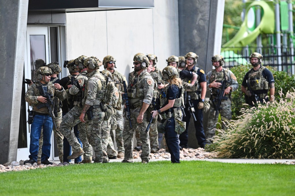 Law enforcement officers outside a building.
