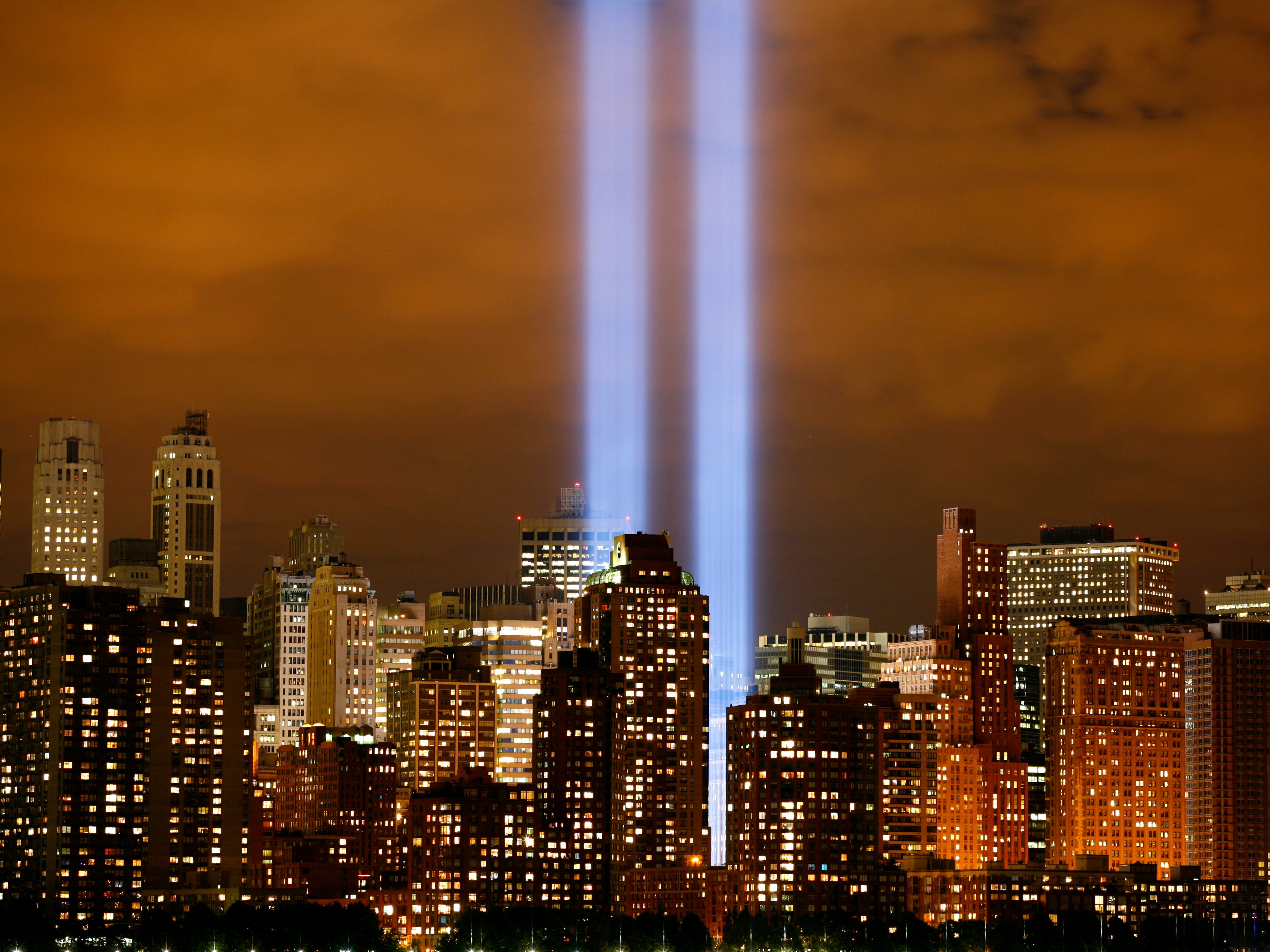 Two beams of light are seen above Manhattan as the 'Tribute in Lights' shines on the skyline on September 11, 2006.