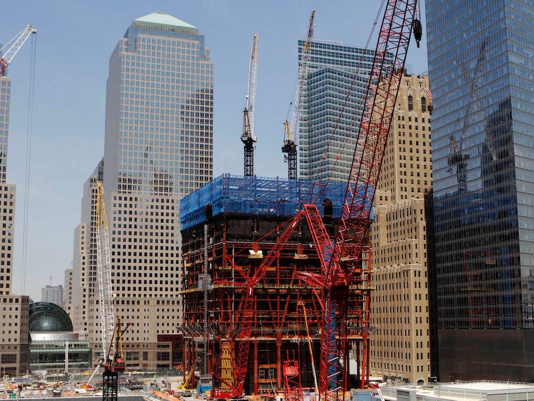 Attacks Redevelopment Construction cranes work above the rising steel structure of One World Trade Center, center, Wednesday, June 2, 2010 in New York.