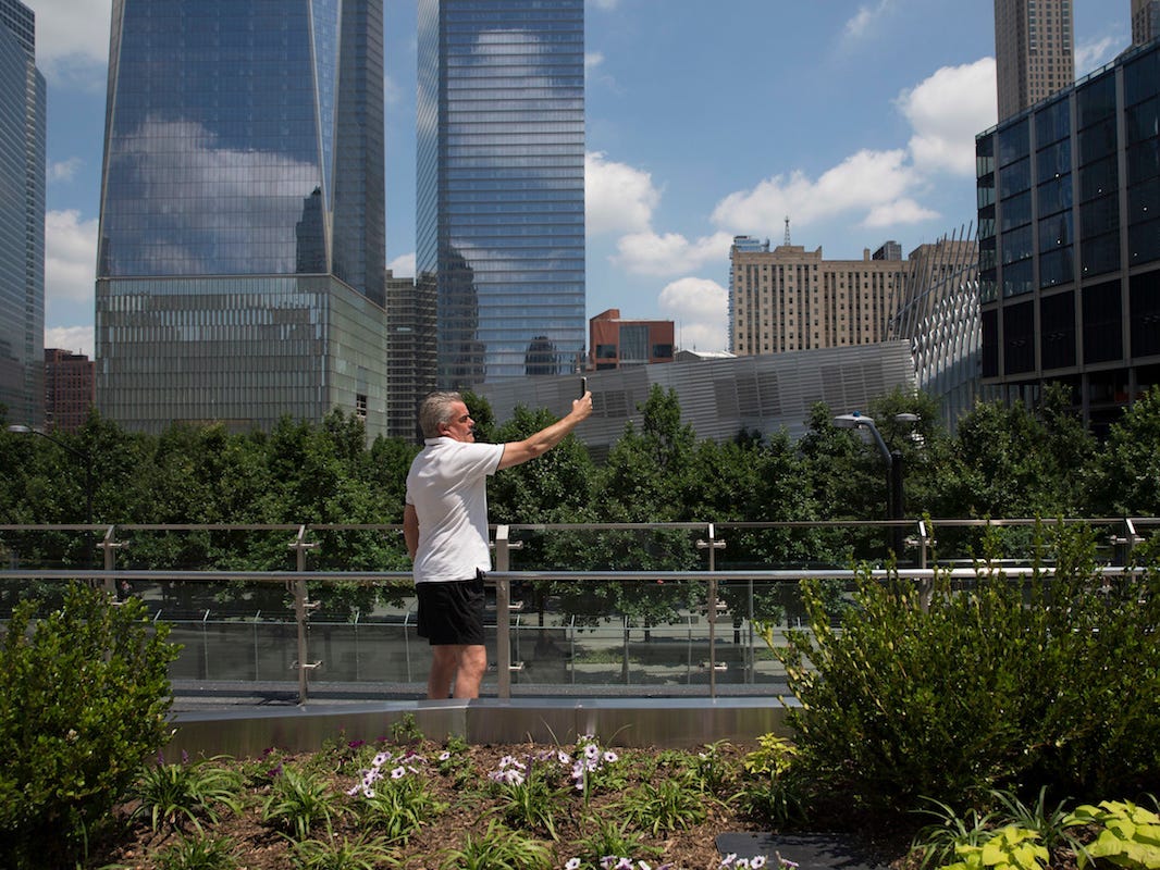 A visitor to Liberty Park takes a selfie, Wednesday, June 29, 2016, in New York.
