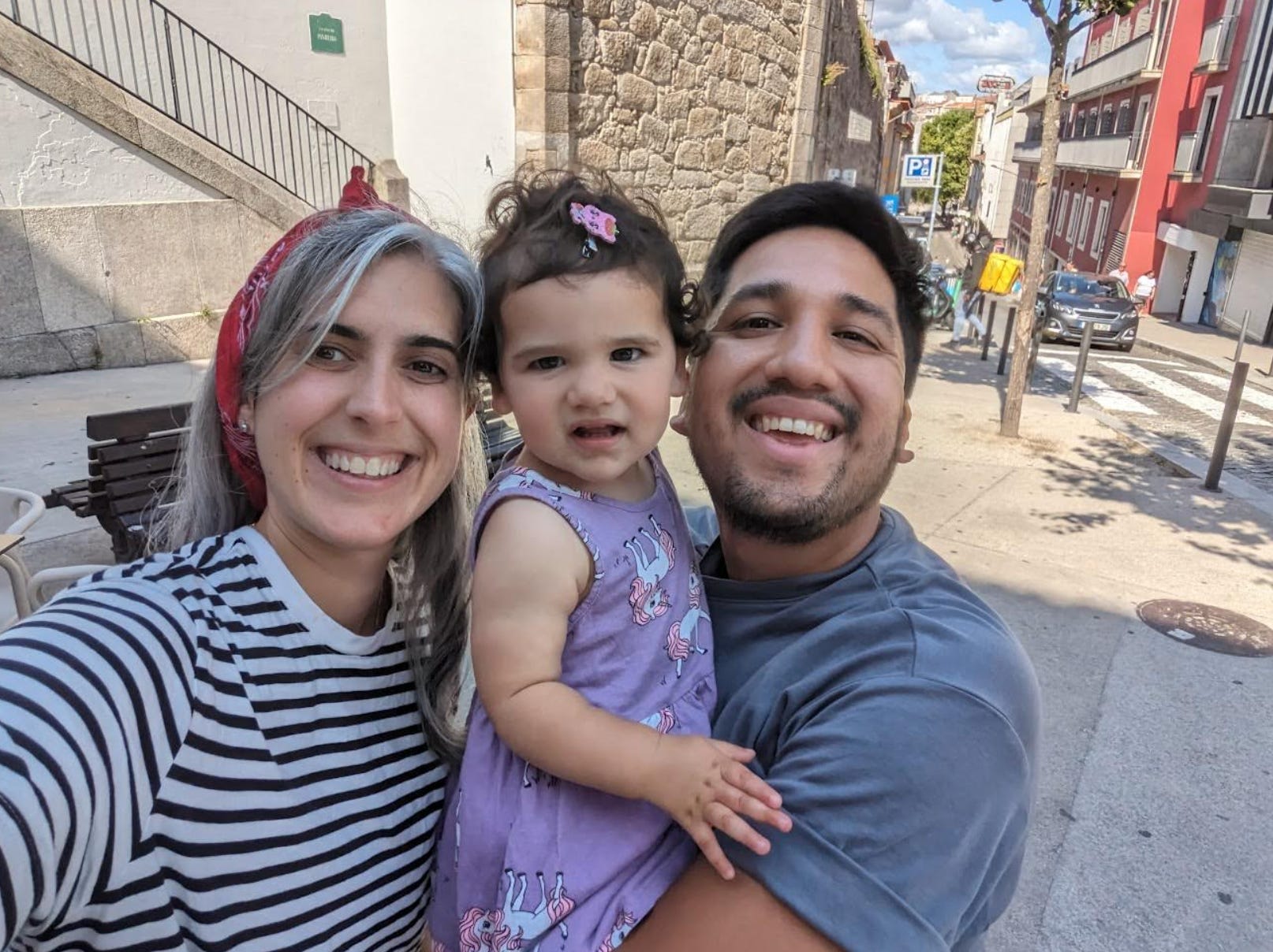 The writer, her husband, and their daughter in Portugal.