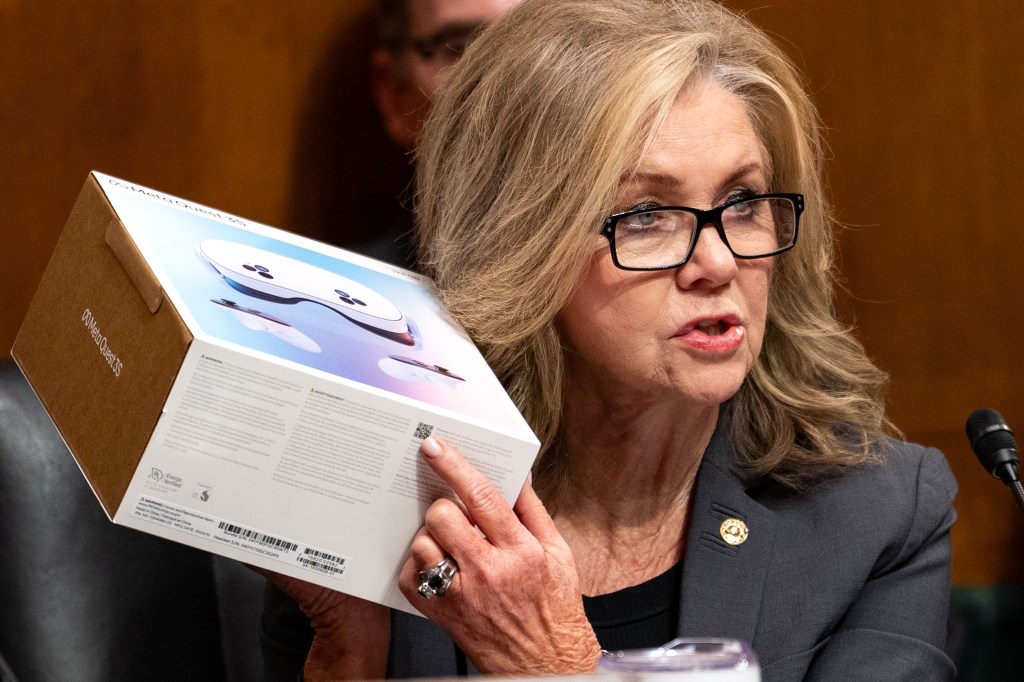 Senator Marsha Blackburn holding up a Meta Quest 35 box during a Senate hearing on Meta's child safety research.