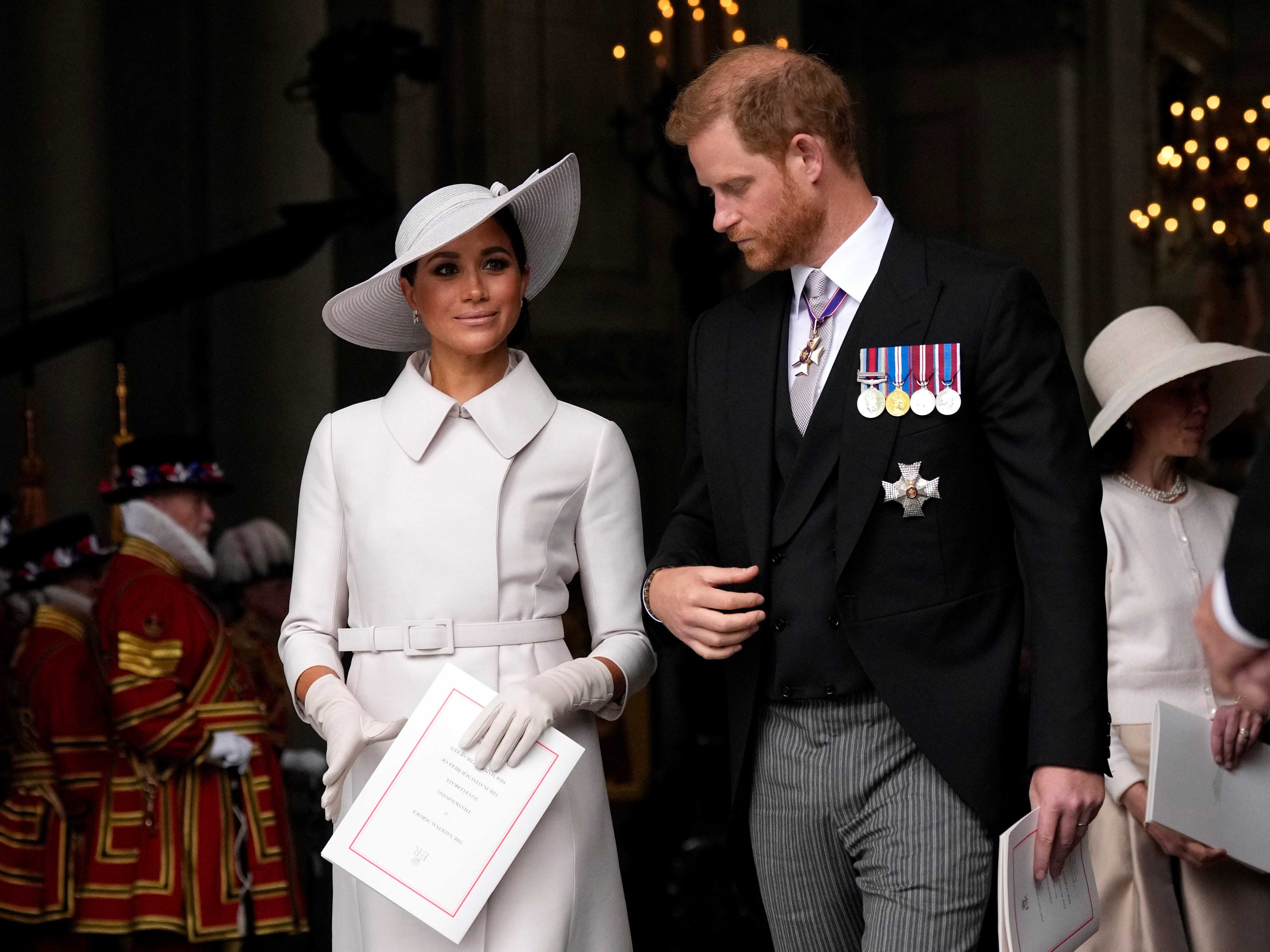 prince harry and meghan markle attending a service celebrating queen elizabeth's platinum jubilee