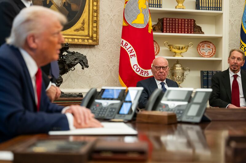 Larry Ellison (R) and media mogul Rupert Murdoch visited the White House in February.