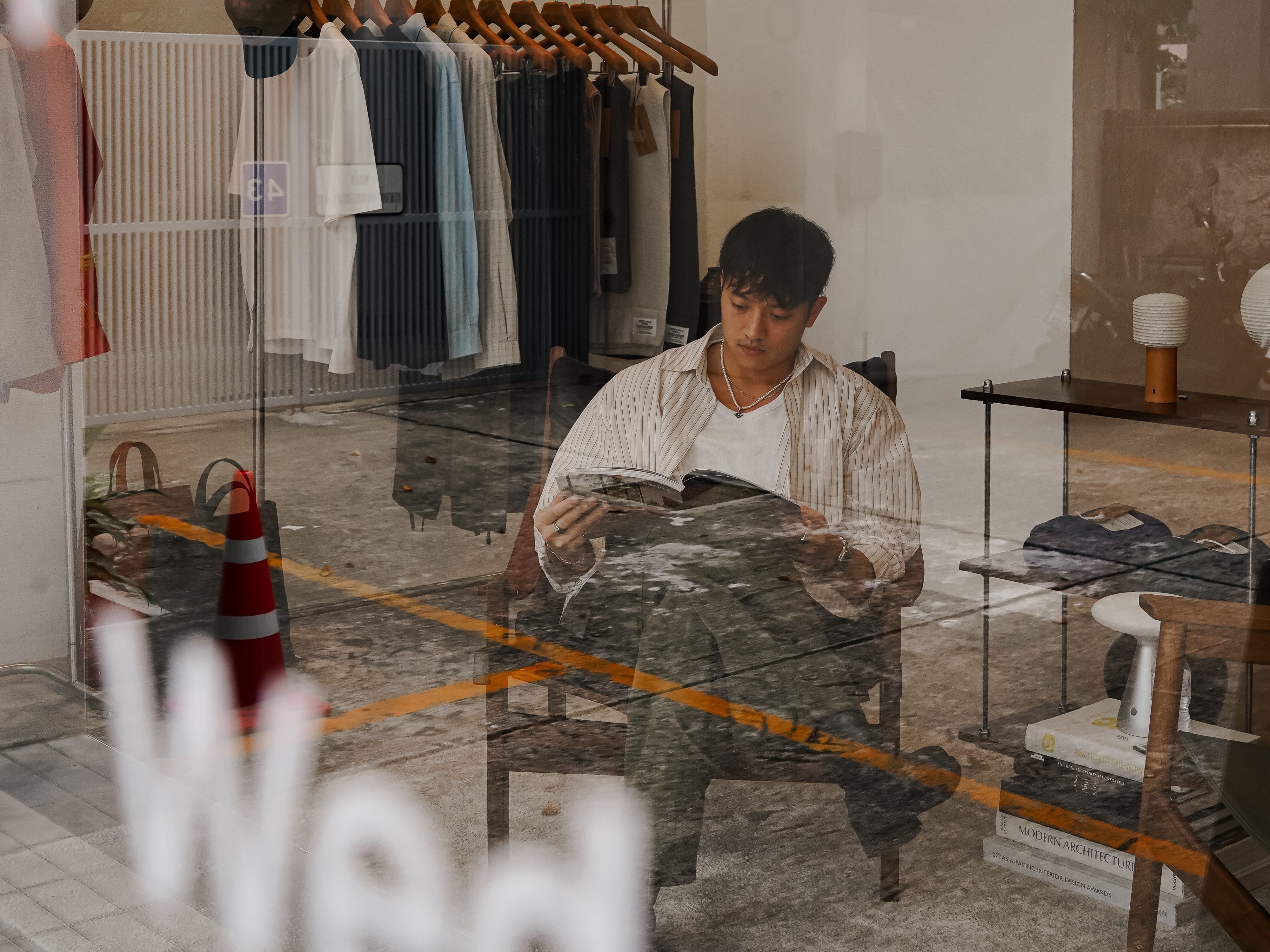 Sutasit Srivisarvacha sitting in Few Better Things, a shop in Bangkok, Thailand.