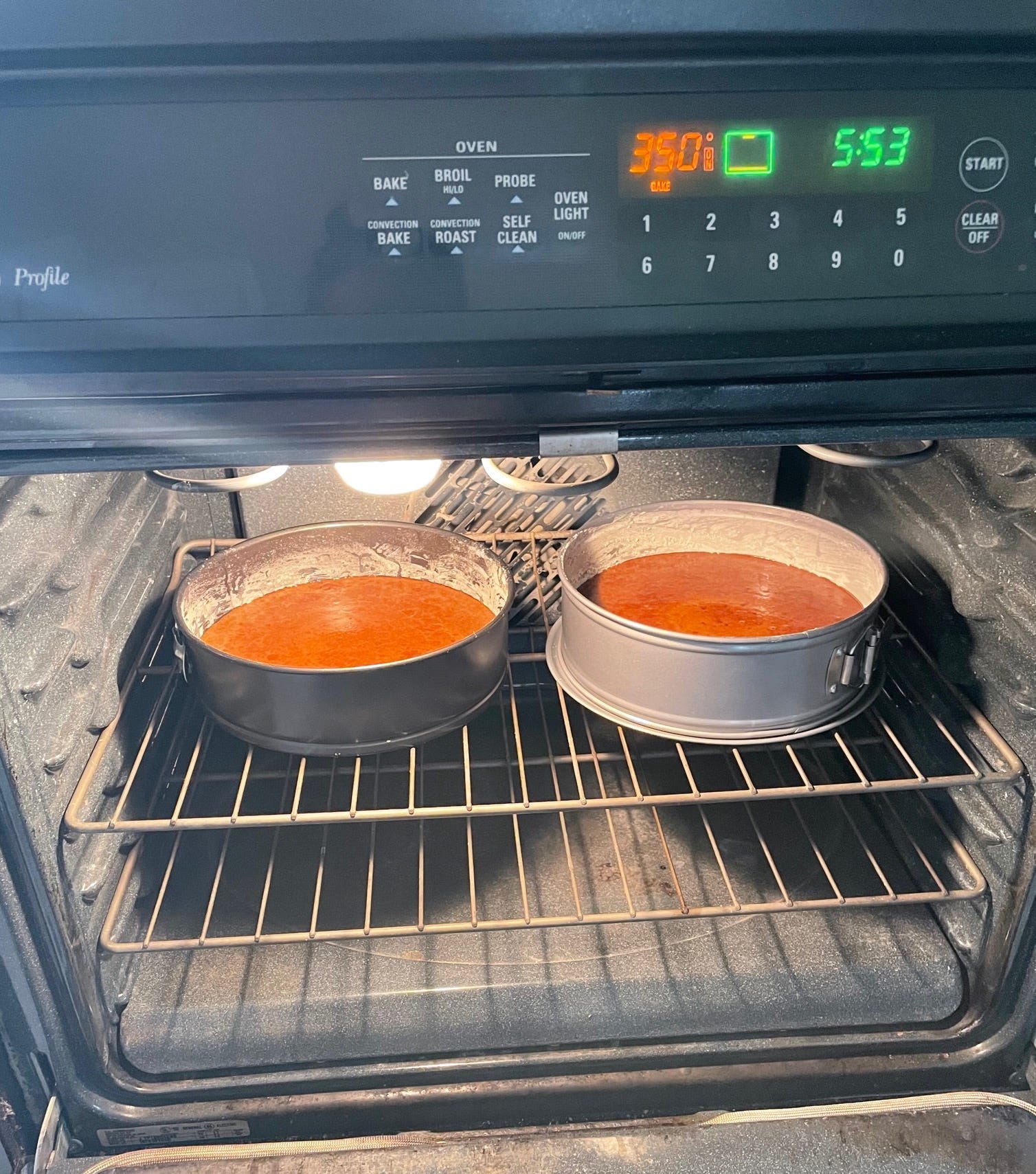 Putting Ina Garten Beatty's Chocolate Cake in oven