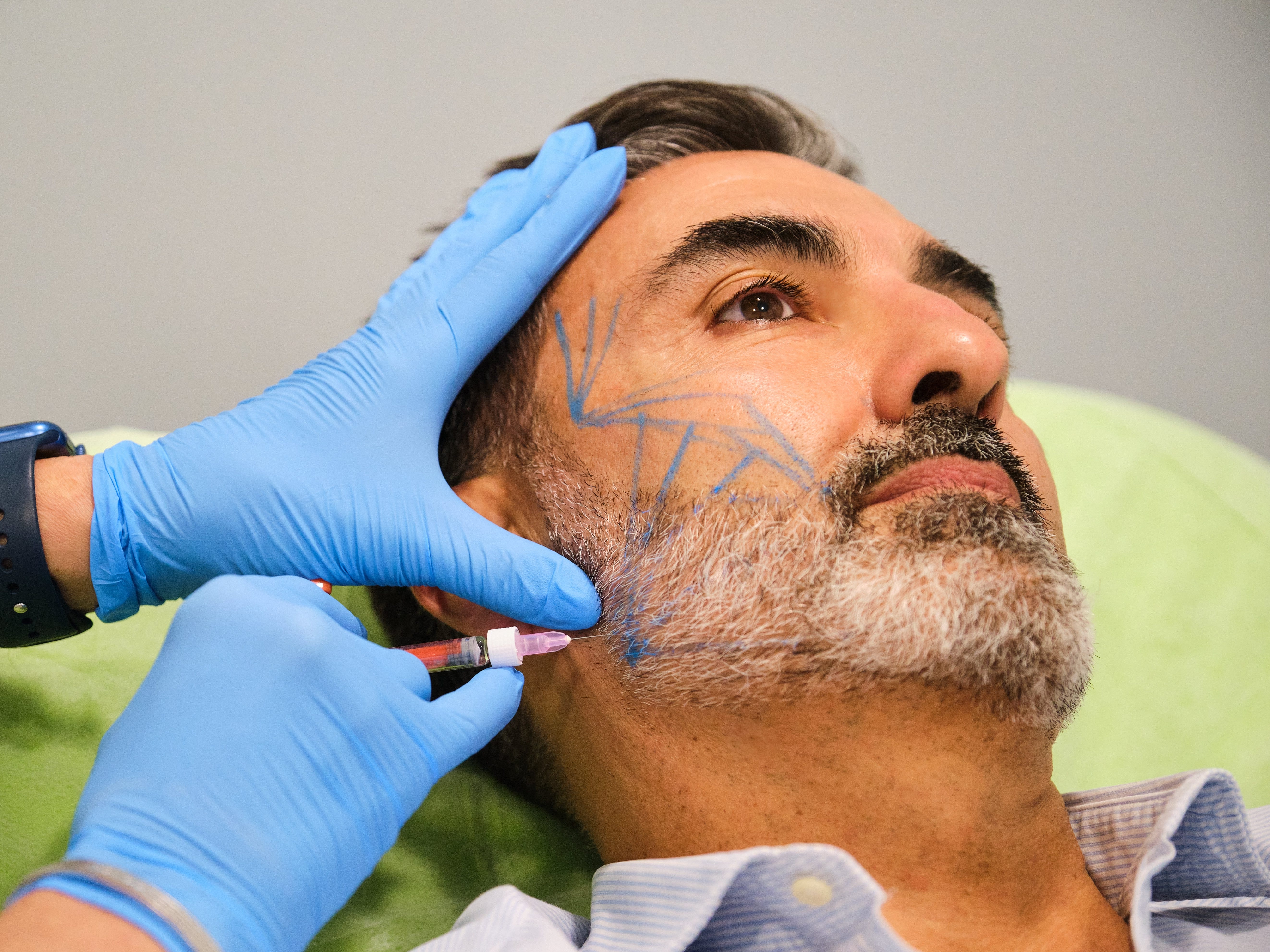 man getting cosmetic procedure