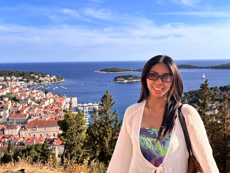 The writer in front of the water on her Europe trip.