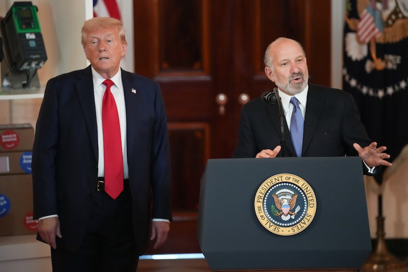 President Donald Trump listens as Commerce Secretary Howard Lutnick speaks in the Cross Hall of the White House on April 30, 2025 in Washington, DC.