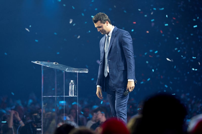 Charlie Kirk greets the crowd during the 2024 AmericaFest conference in Phoenix, Arizona on December 19, 2024.