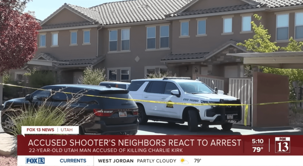 Law enforcement vehicles park inside police tape infront of Tyler Robinson's apartment in St. George, Utah, on Sept. 12, 2025.