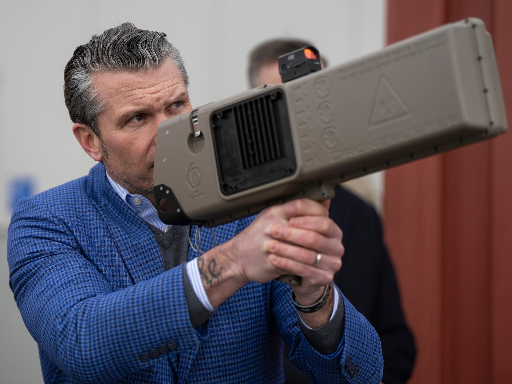 Defense Secretary Pete Hegseth held a Dronebuster jammer in February.