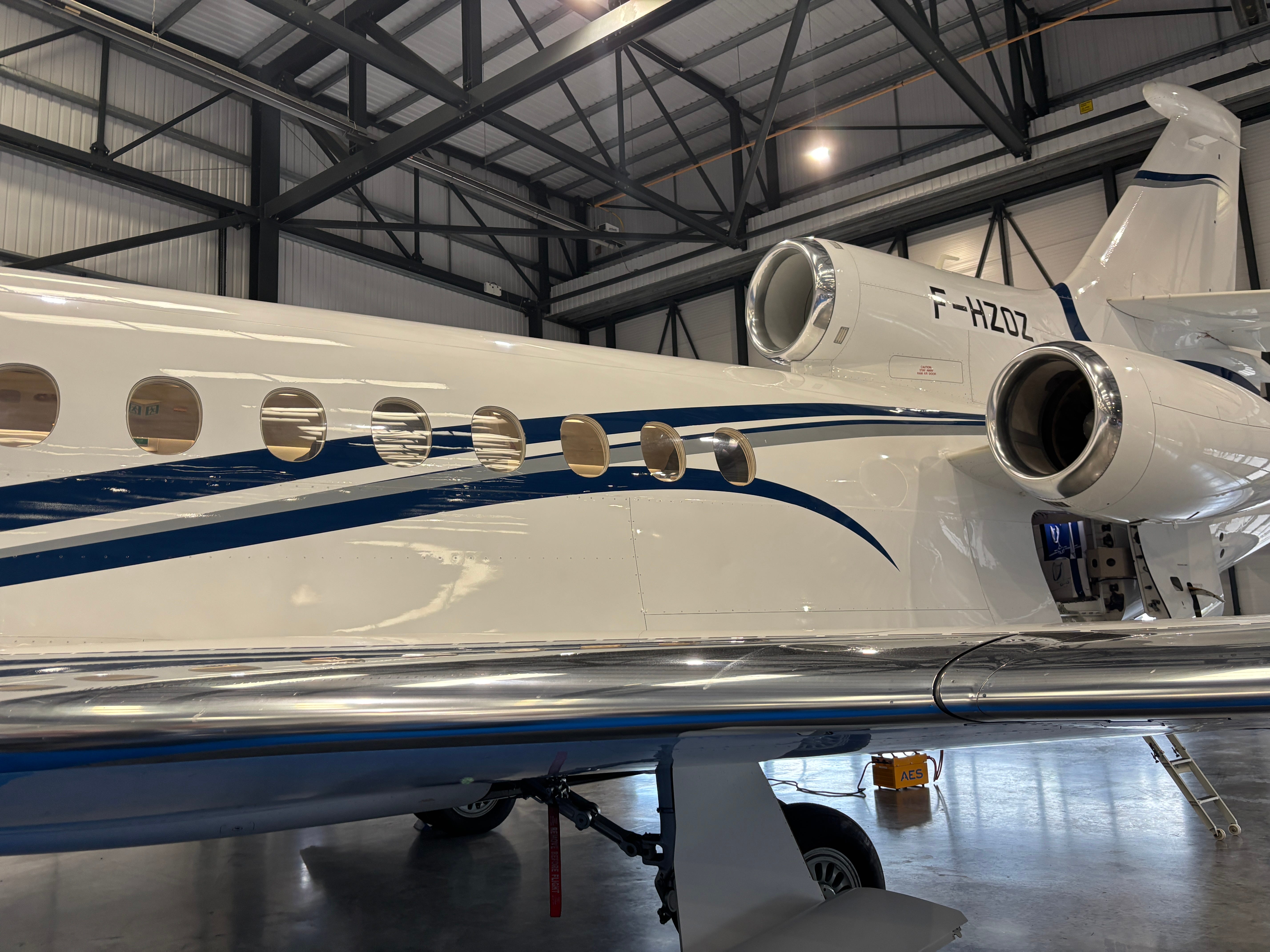 A close up of the engines of a Dassault Falcon 8X on display at the 2025 Air Charter Expo