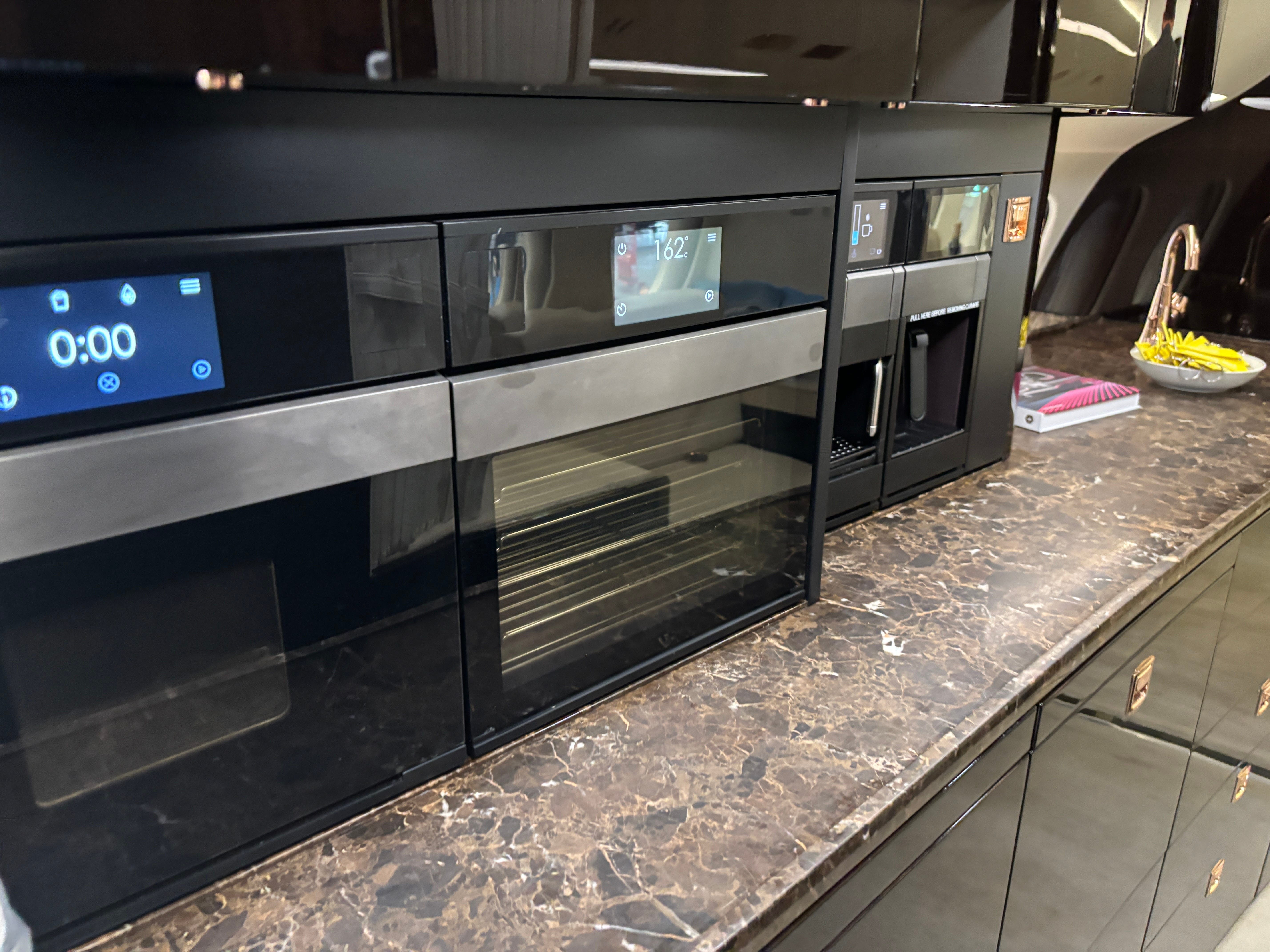 Kitchen equipment in the galley on board a Dassault Falcon 8X on display at the 2025 Air Charter Expo