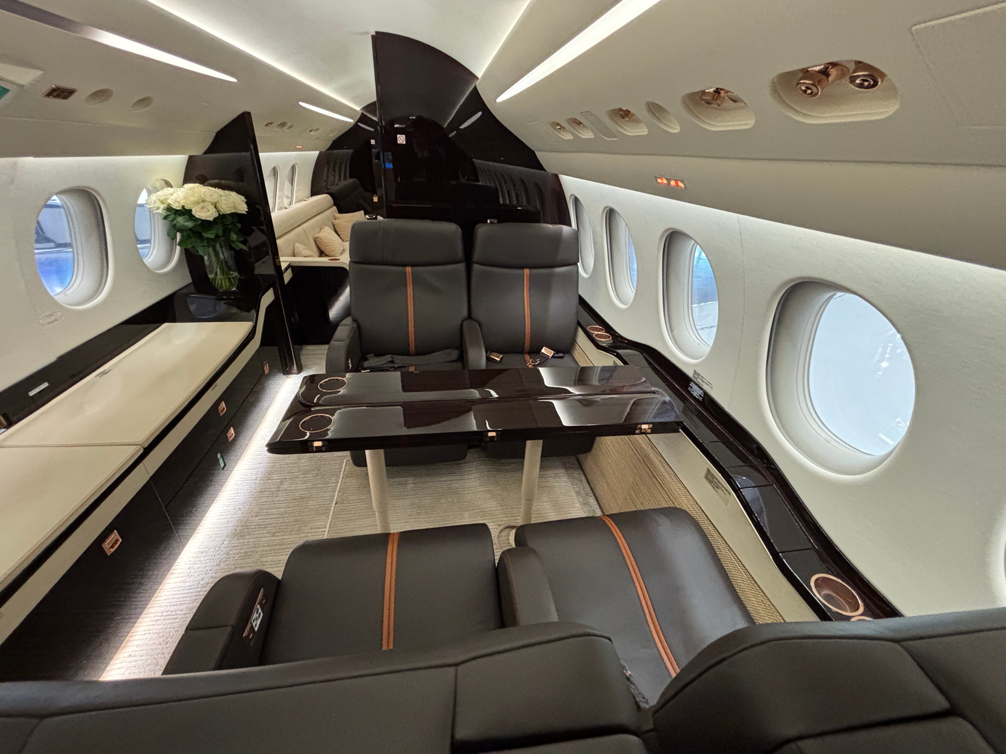 Four seats in the main cabin of a Dassault Falcon 8X on display at the 2025 Air Charter Expo