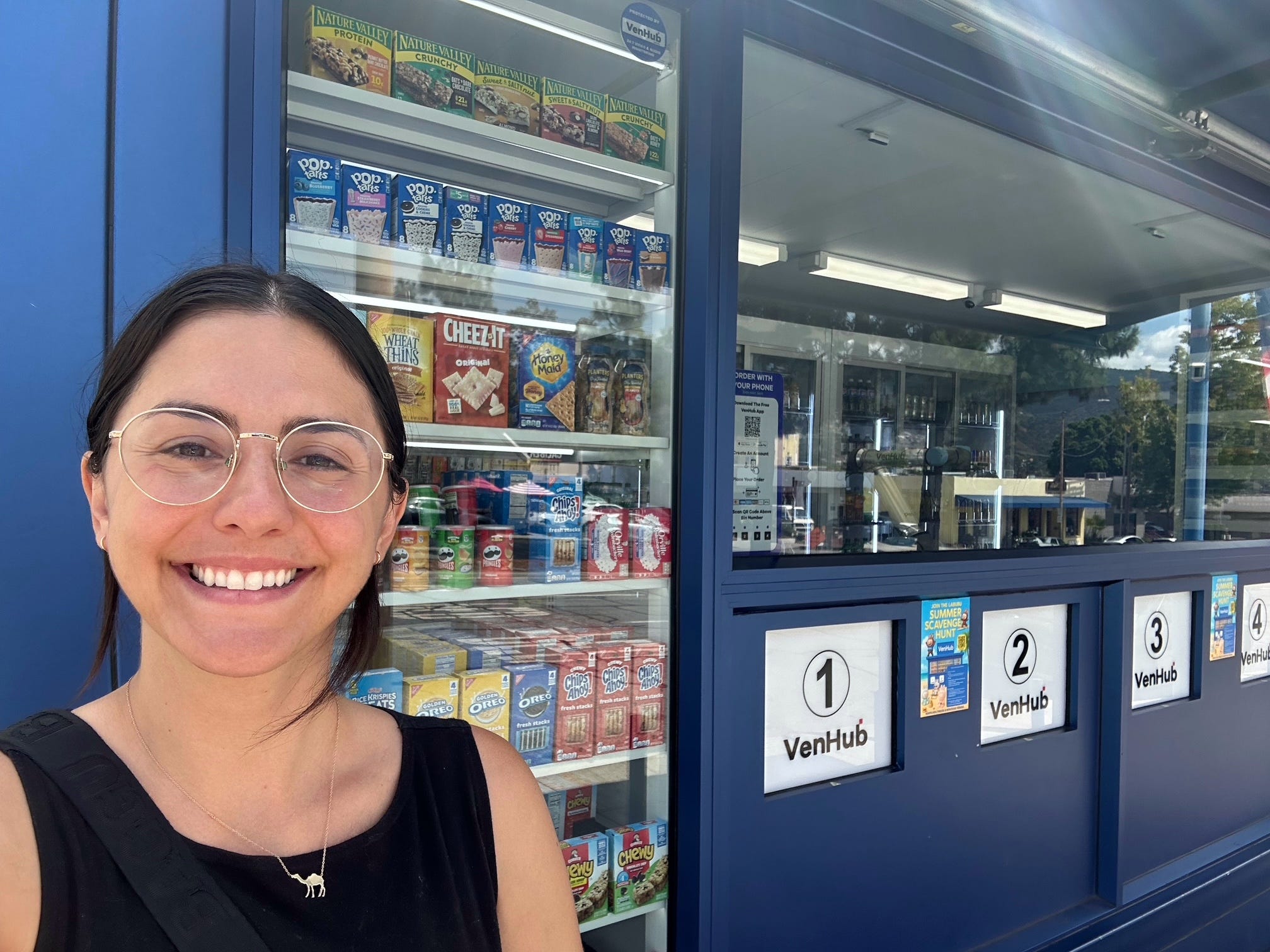 Selfie of author with VenHub store in background