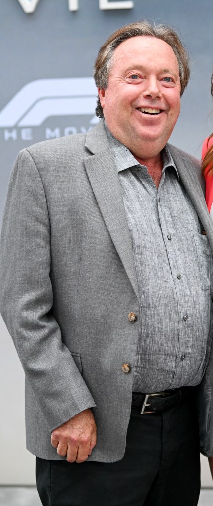 gelfond smiling in a grey blazer and grey button down