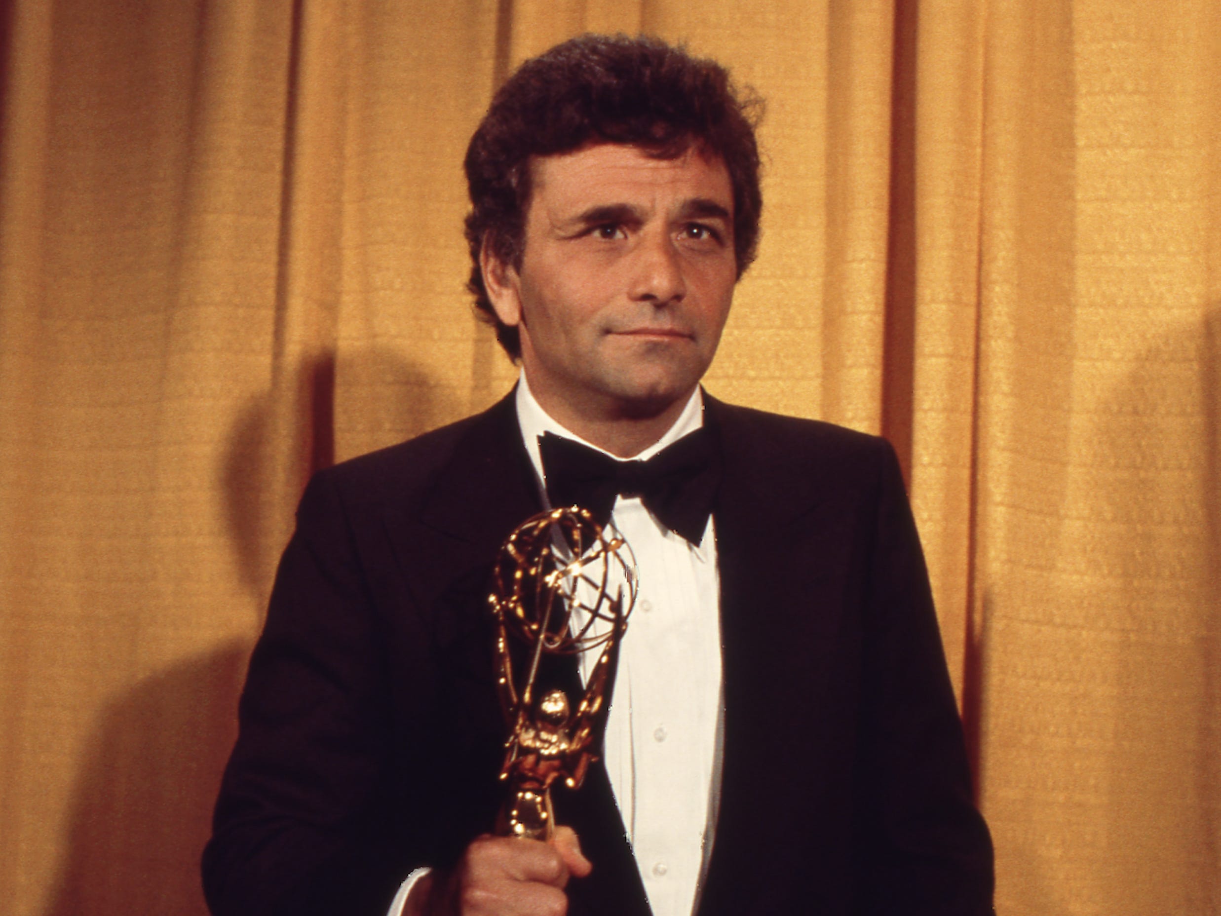 Peter Falk holding Emmy Award in the press room at the 28th Annual Primetime Emmy Awards on May 17, 1976