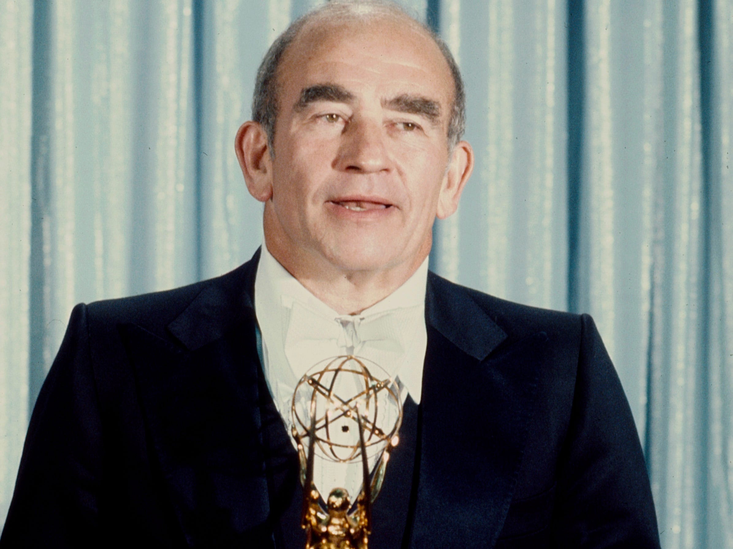Edward Asner with his award for Outstanding Single Performance by a Supporting Actor in a Comedy or Drama at the 1977 / 29th Primetime Emmy Awards, at the Pasadena Civic Auditorium