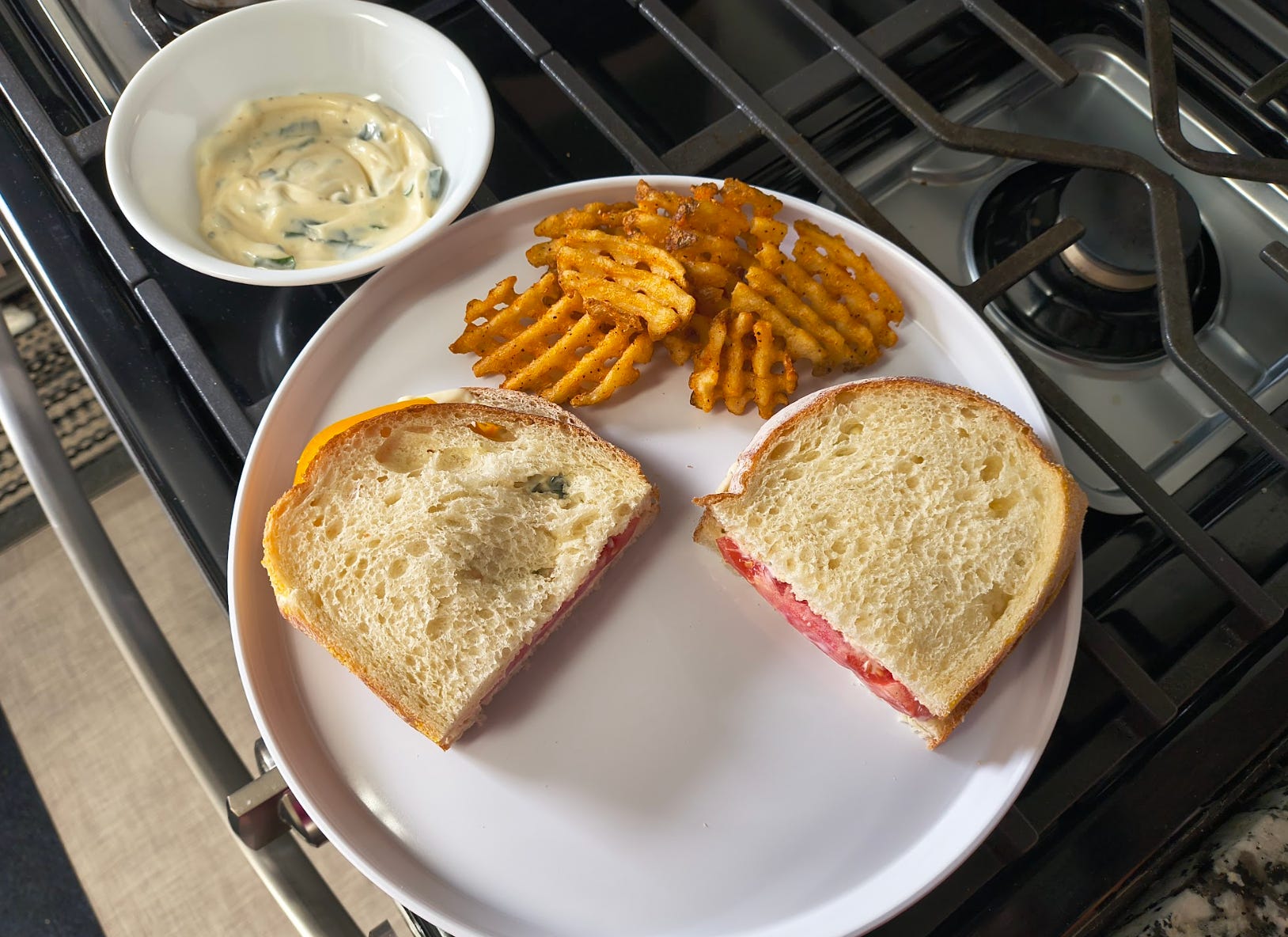 Ina Garten's tomato sandwich, waffles fries, and basil mayo.