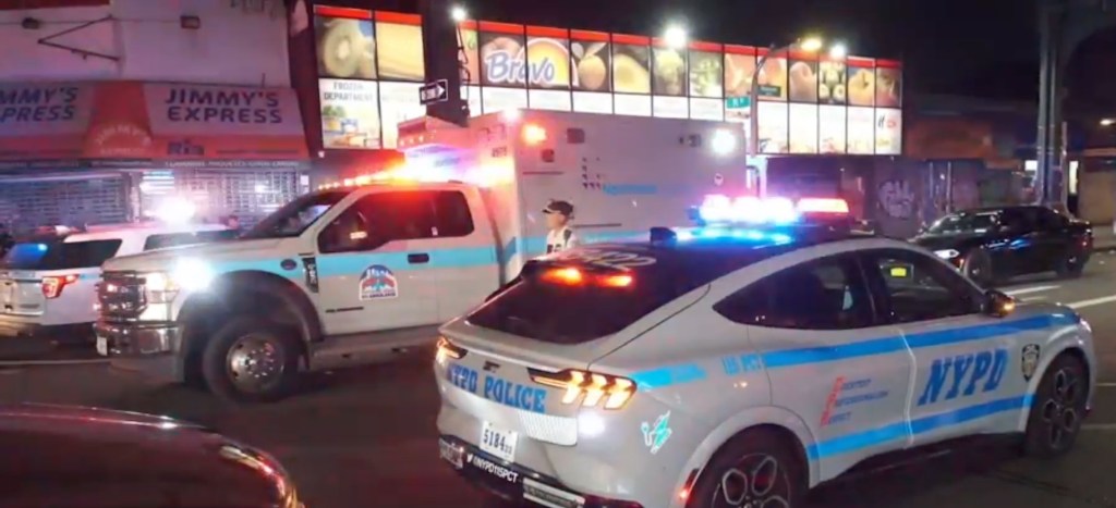 NYPD vehicles at the scene of a fatal accident.