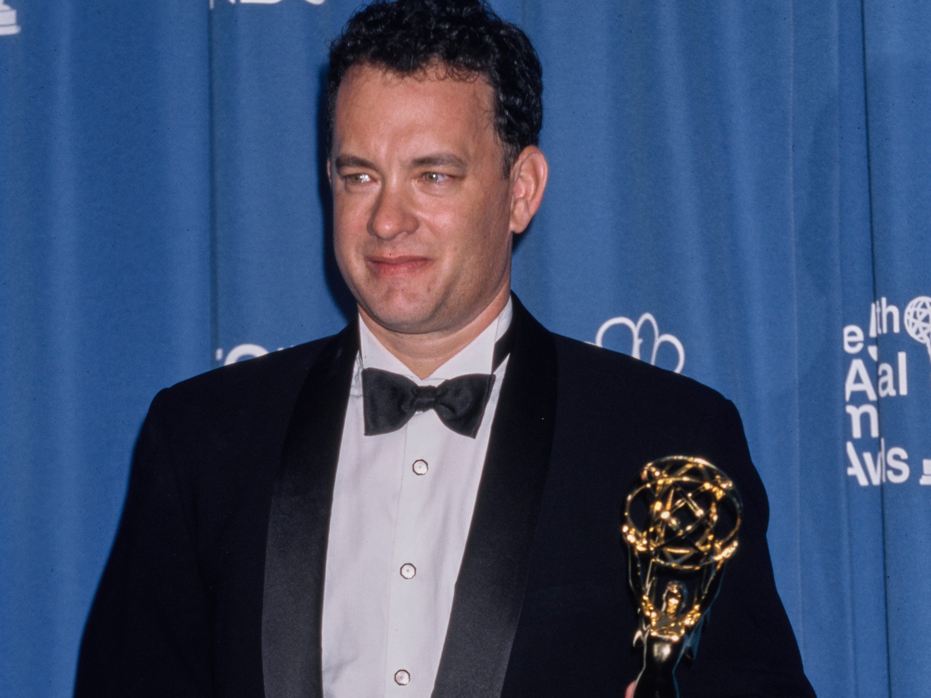 American actor Tom Hanks posing with his award trophy at the 50th Annual Emmy Awards, held at the Shrine Auditorium in Los Angeles, California, September 13th 1998.