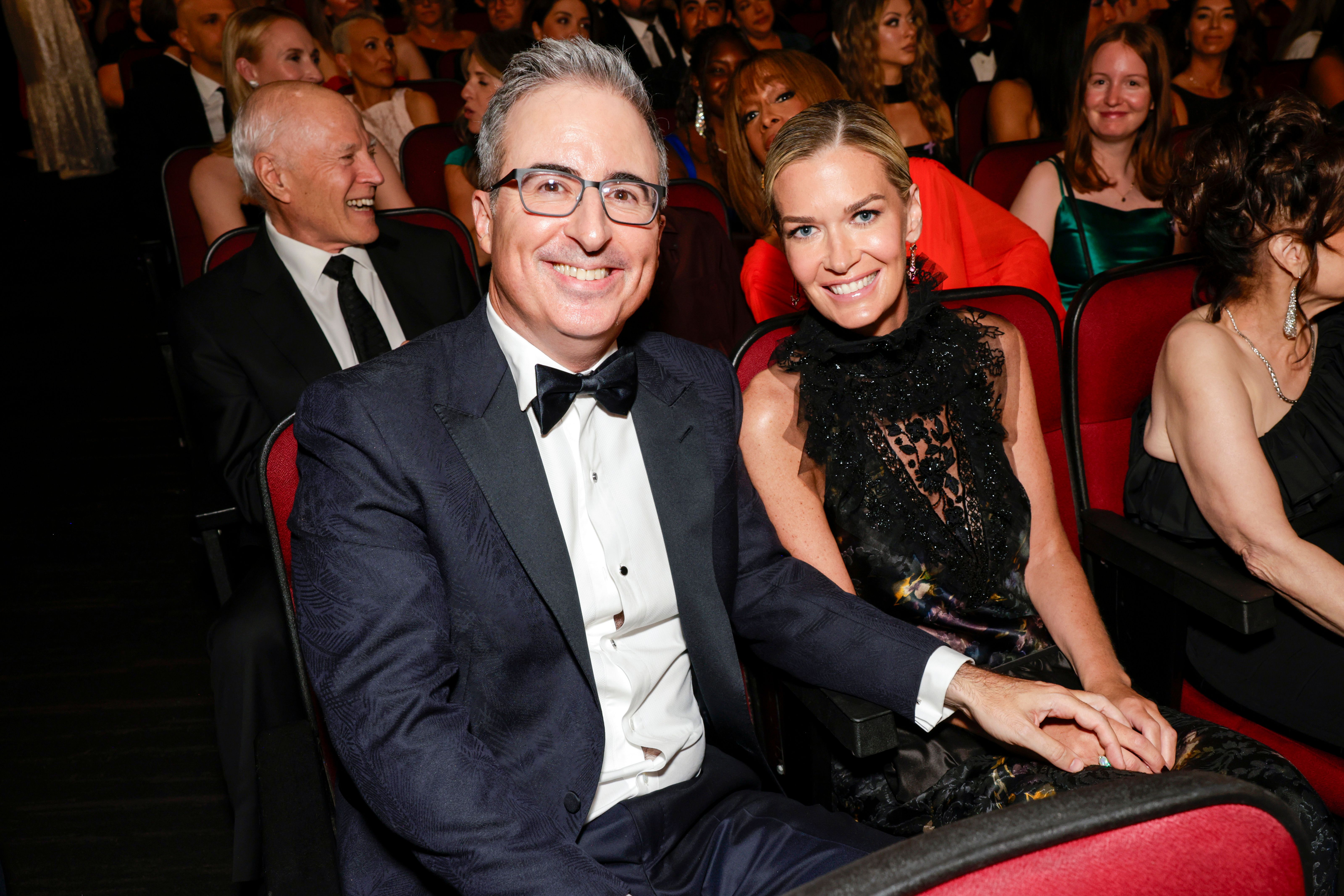 John Oliver and Kate Norley attend The 77th Primetime Emmy Awards