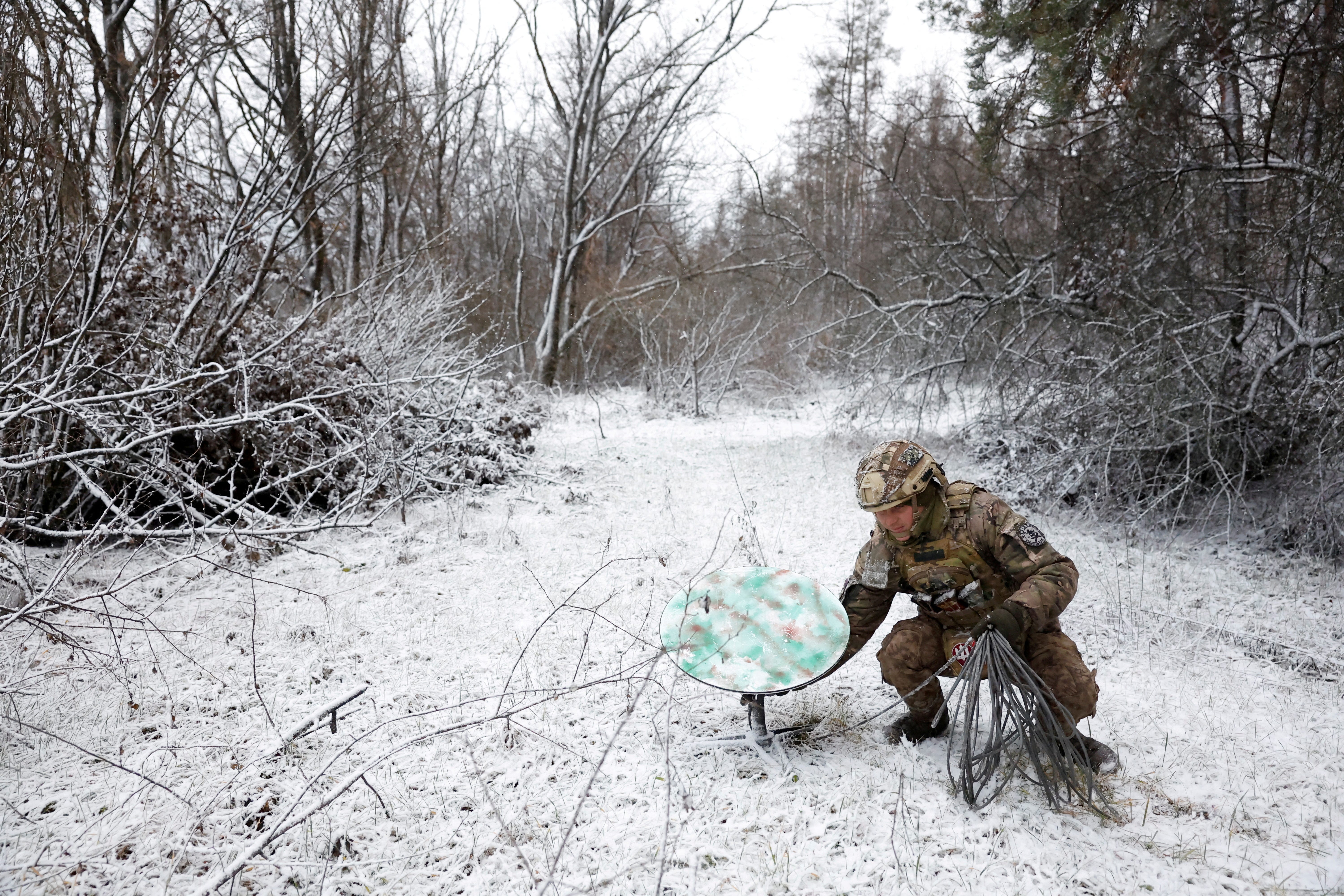 “Psycho”, 22 from the 80th Separate Air Assault Brigade disconnects their Starlink on the front line at Orthodox Christmas, during a ceasefire announced by Russia over the Orthodox Christmas period, from the frontline region of Kreminna, Ukraine, January 6, 2023.