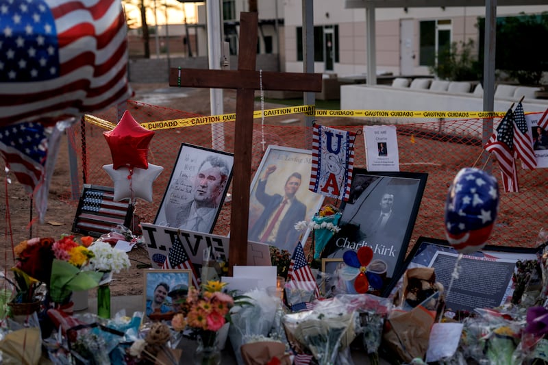 People paying their respects have left items at a memorial for Charlie Kirk at the headquarters of Turning Point USA in Phoenix, Arizona.