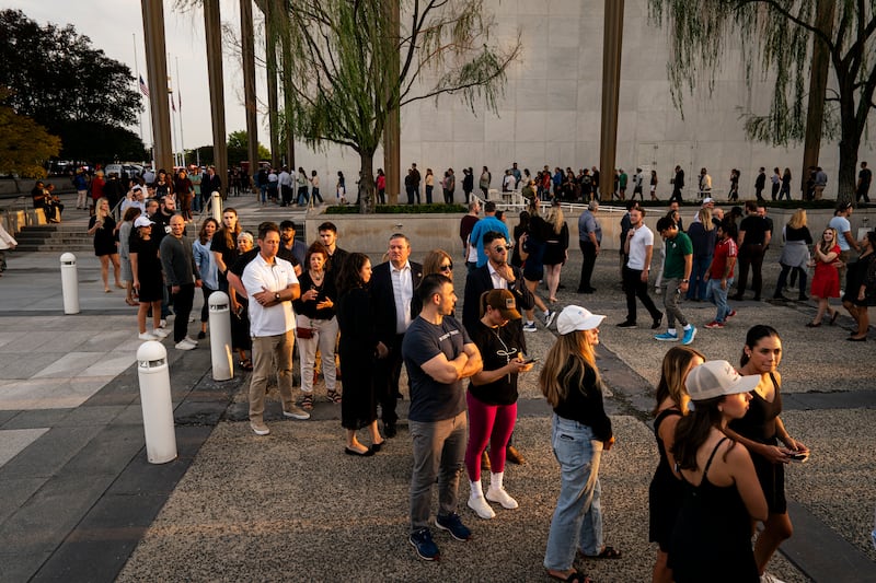 People wait in line prior to a prayer vigil for political activist Charlie Kirk outside the Kennedy Center on September 14, 2025 in Washington, DC.