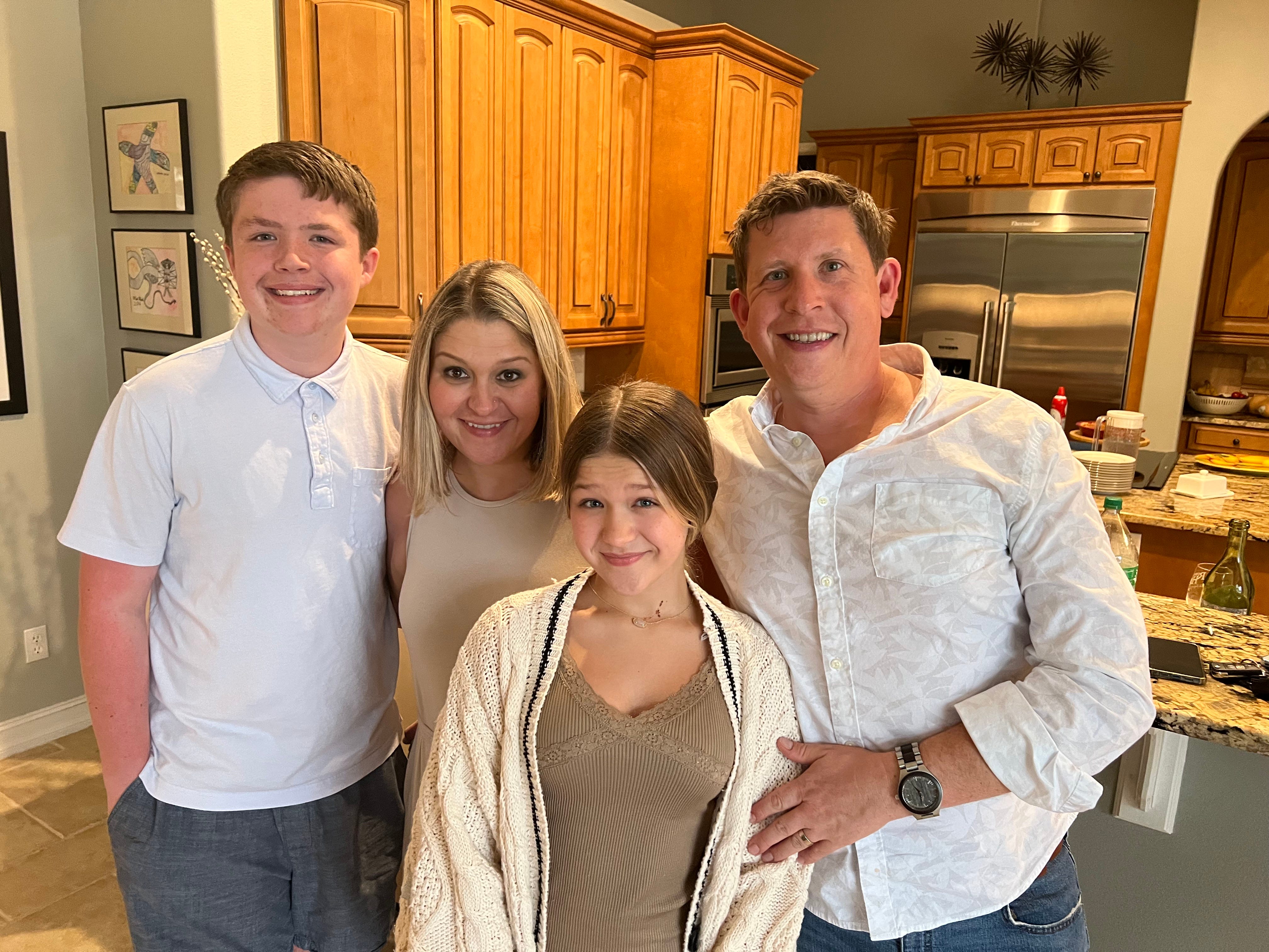 The author and her family having Thanksgiving dinner at a friends' house.